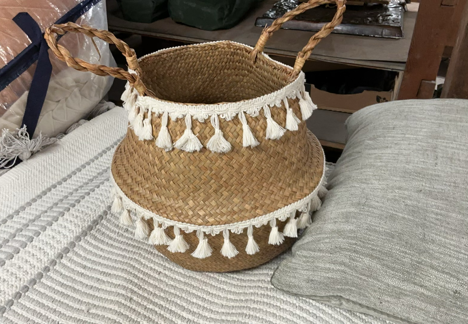 Woven throw blanket, straw basket with tassels, grey cushions, and tassel rug - image 2 of 8