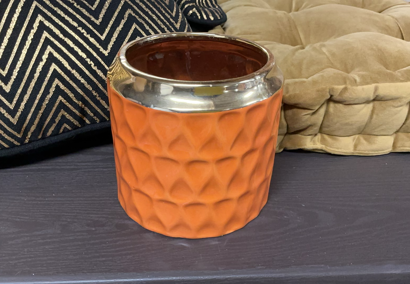 Beige tufted cushions with chevron pillows and orange candle holder - image 3 of 4