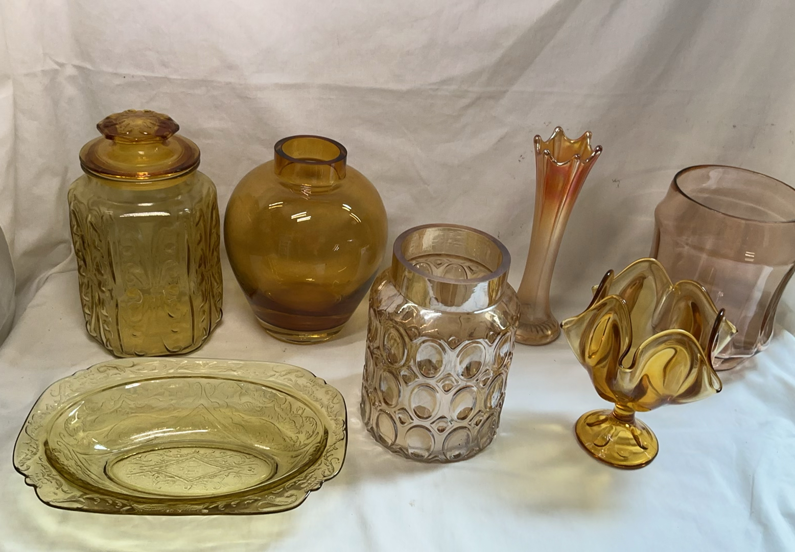 Assorted vintage amber and pink glassware: vases, jars, and plate - image 1 of 4