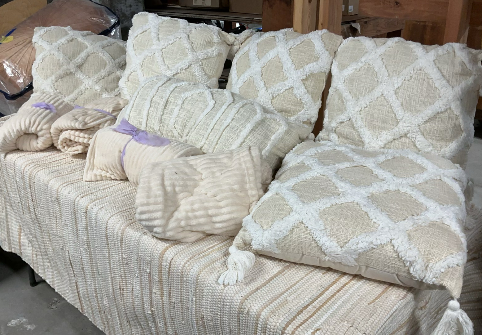 Beige decorative pillows and matching throws - image 1 of 6