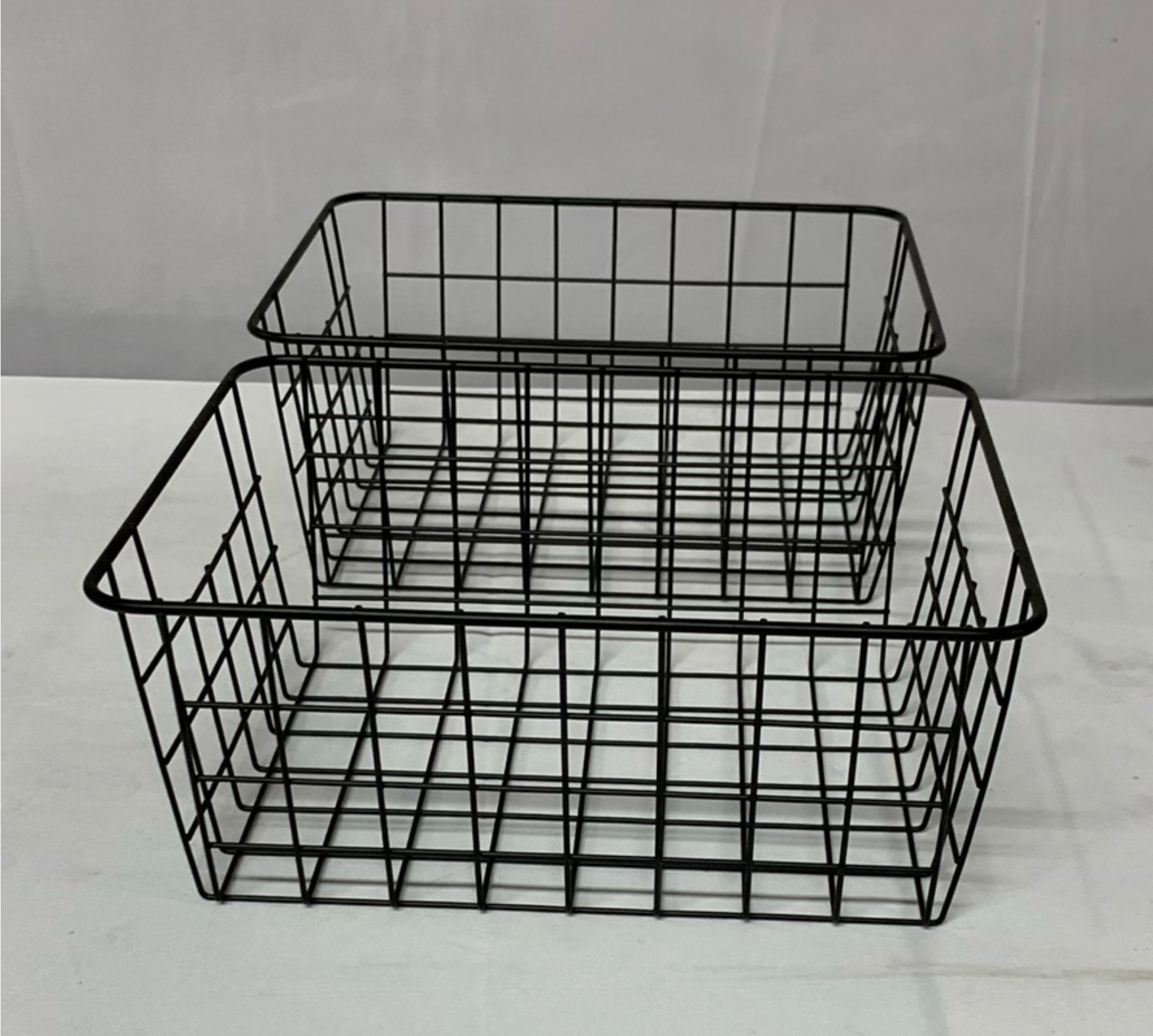 Black metal lanterns, wire baskets, and wooden tray stand - image 2 of 5