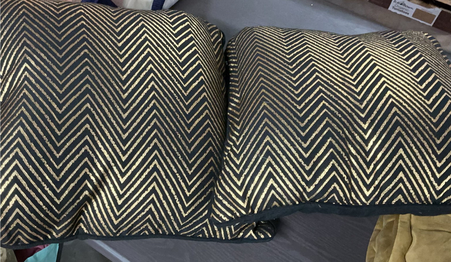 Beige tufted cushions with chevron pillows and orange candle holder - image 4 of 4