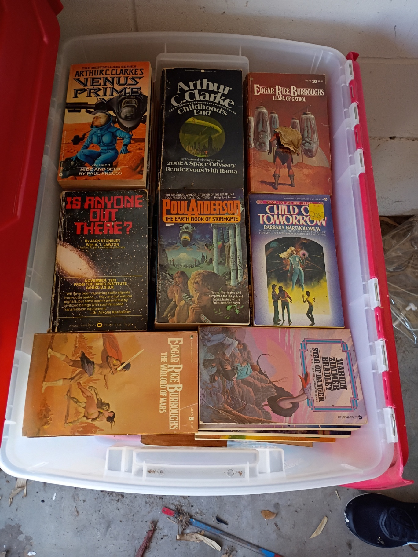 Collection of Science Fiction Paperback Books in Plastic Storage Bin - image 1 of 4