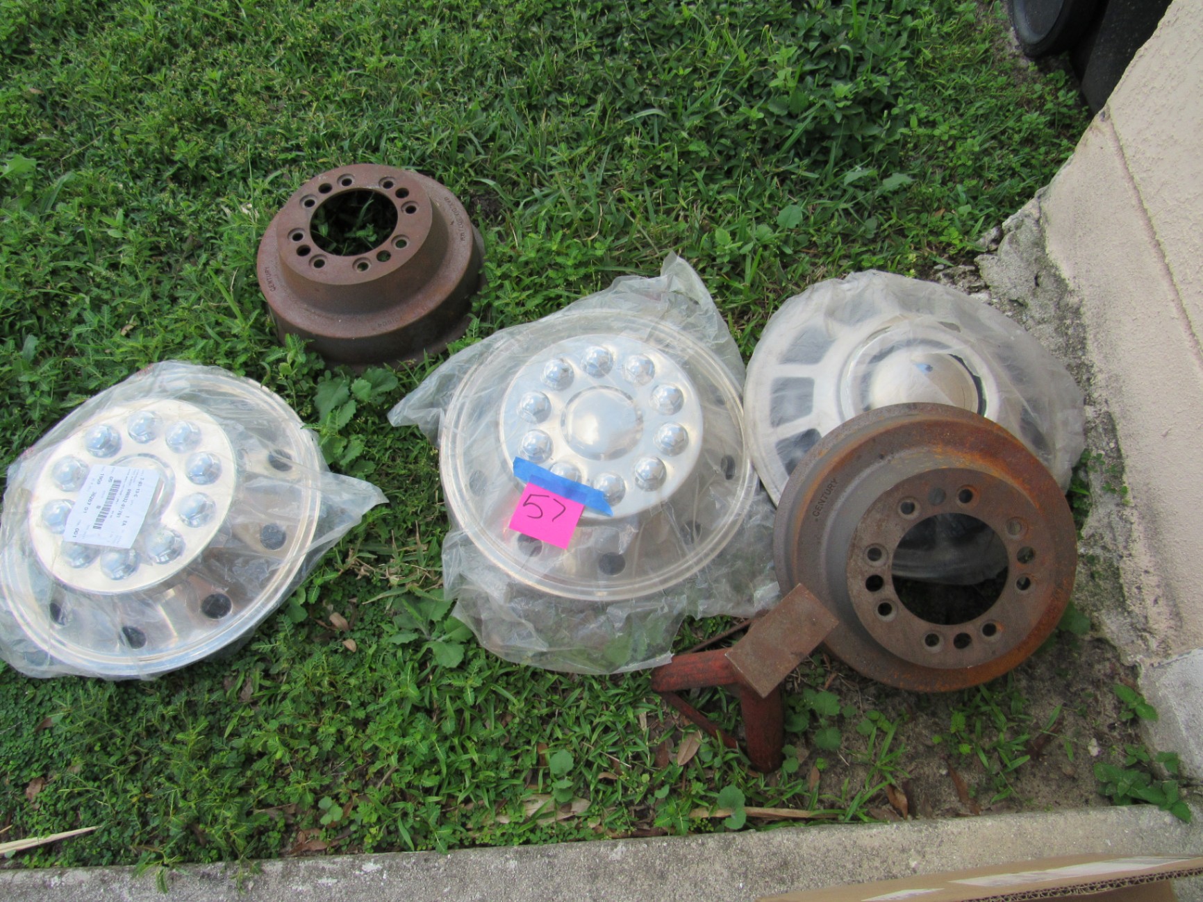 Truck Wheel Covers, Brake Drums, and Jack Stand - image 1 of 2
