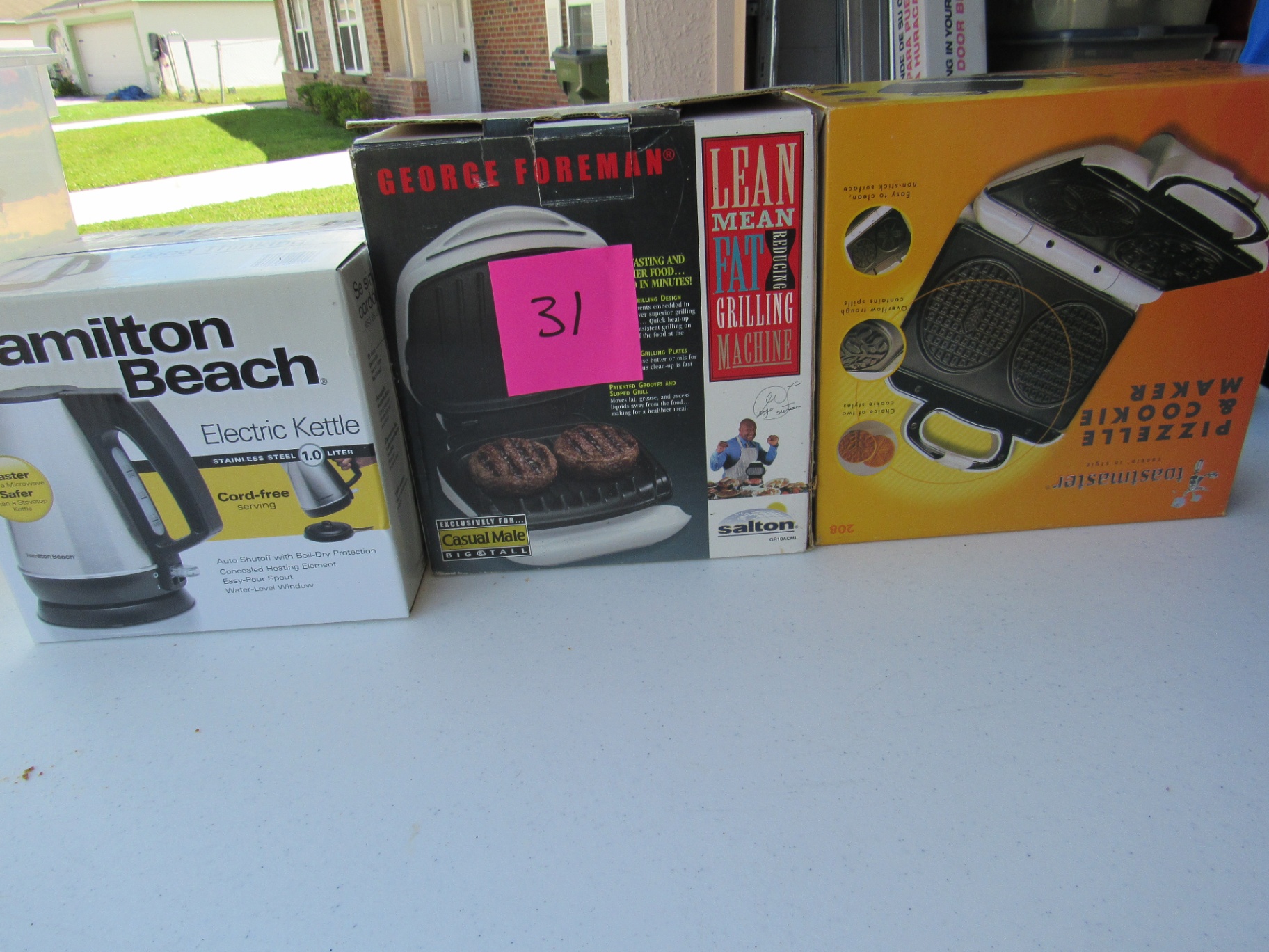 Hamilton Beach Electric Kettle, George Foreman Grill, and Toastmaster Pizzelle Cookie Maker - image 1 of 4