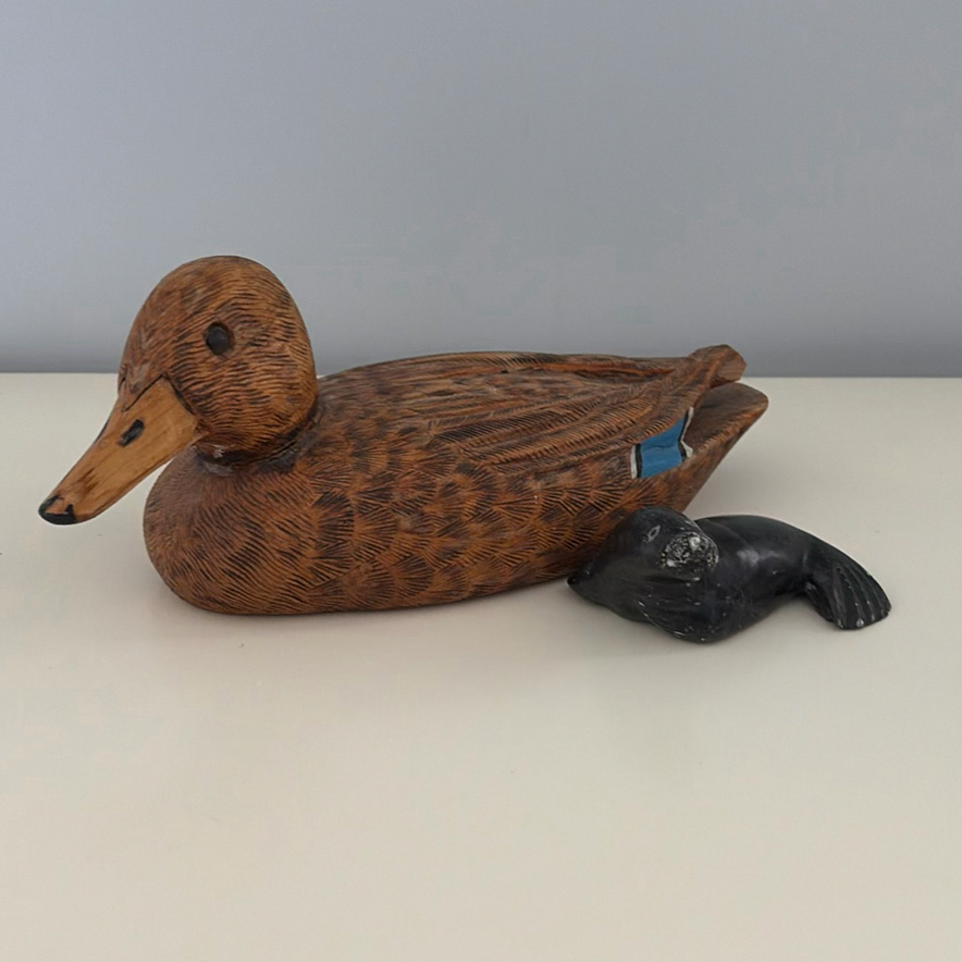 Carved Duck Decoy and Seal Figurine - image 1 of 11