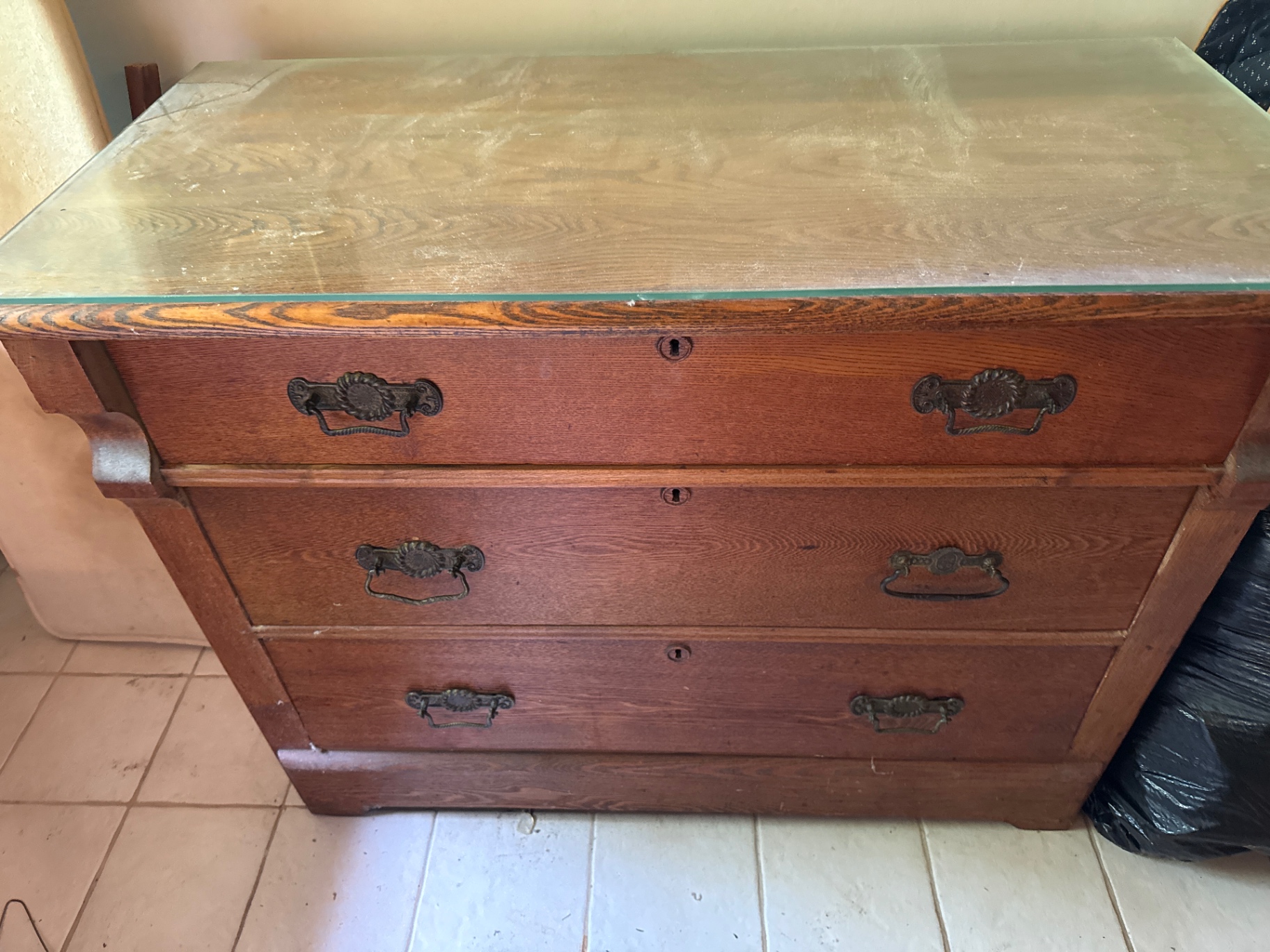 Three-drawer wooden dresser with glass top - image 1 of 2