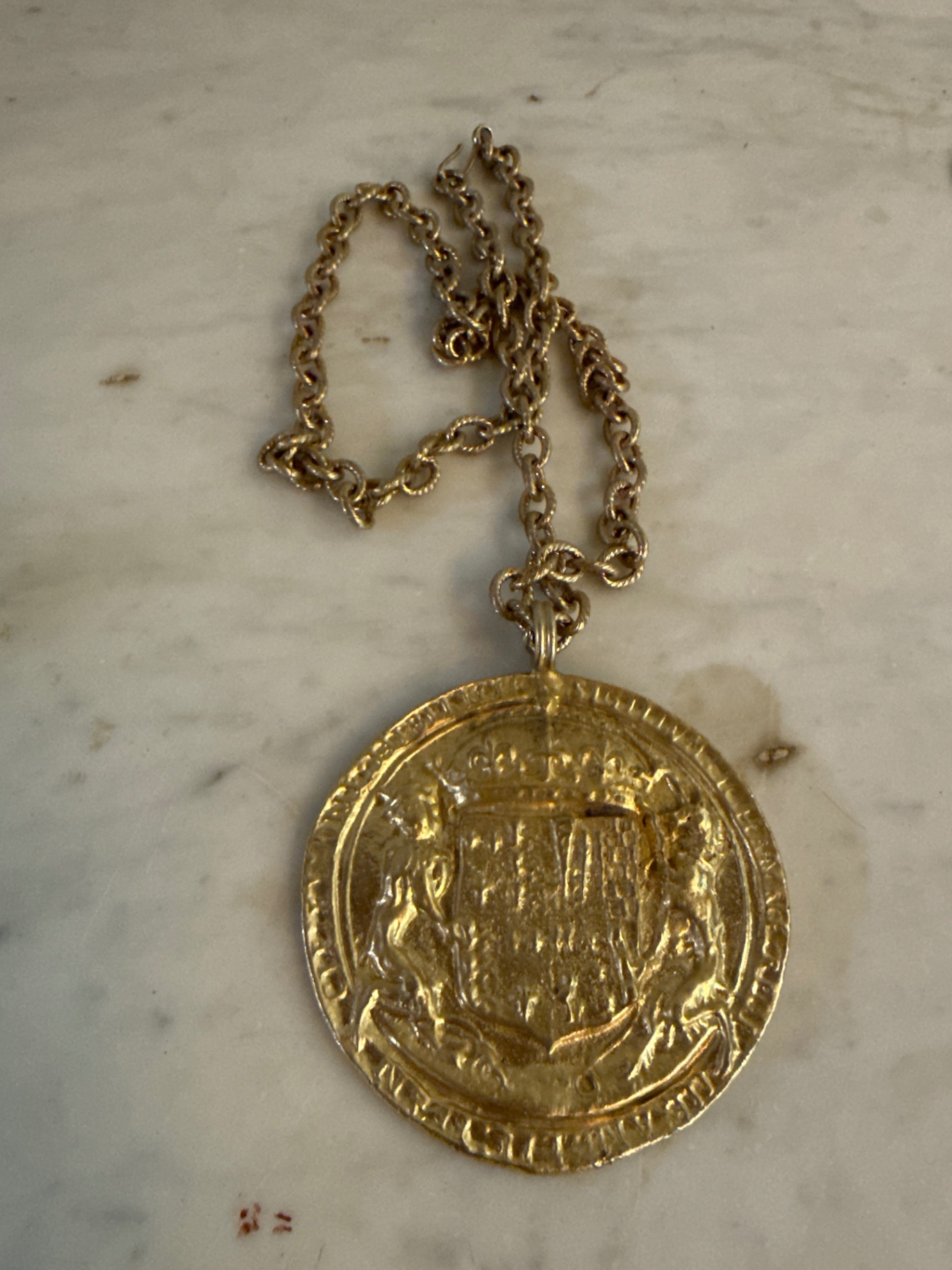 Accessocraft coin  Gold-toned round pendant necklace with crest - image 1 of 3