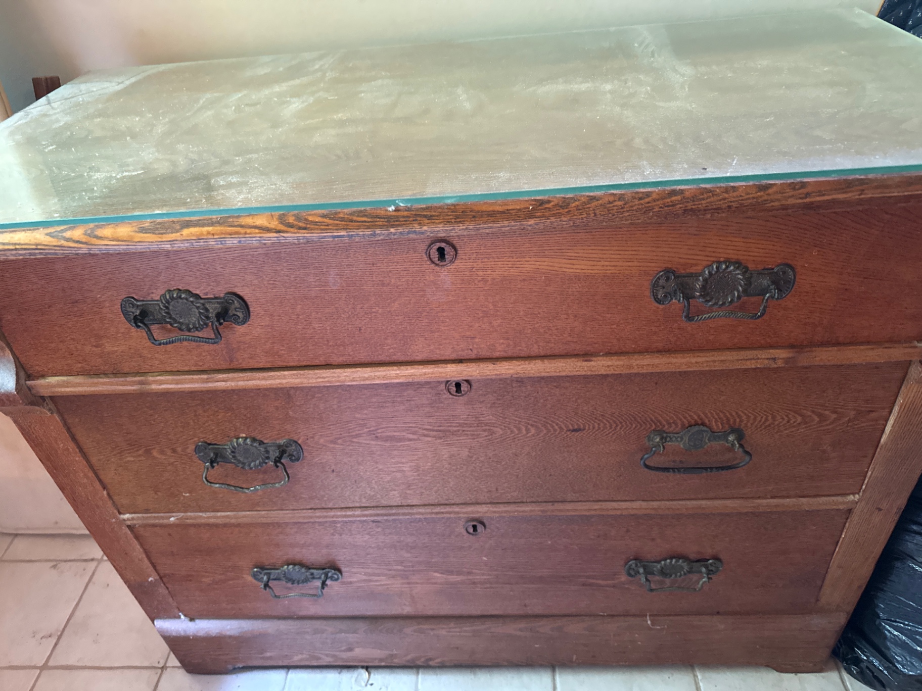 Three-drawer wooden dresser with glass top - image 2 of 2