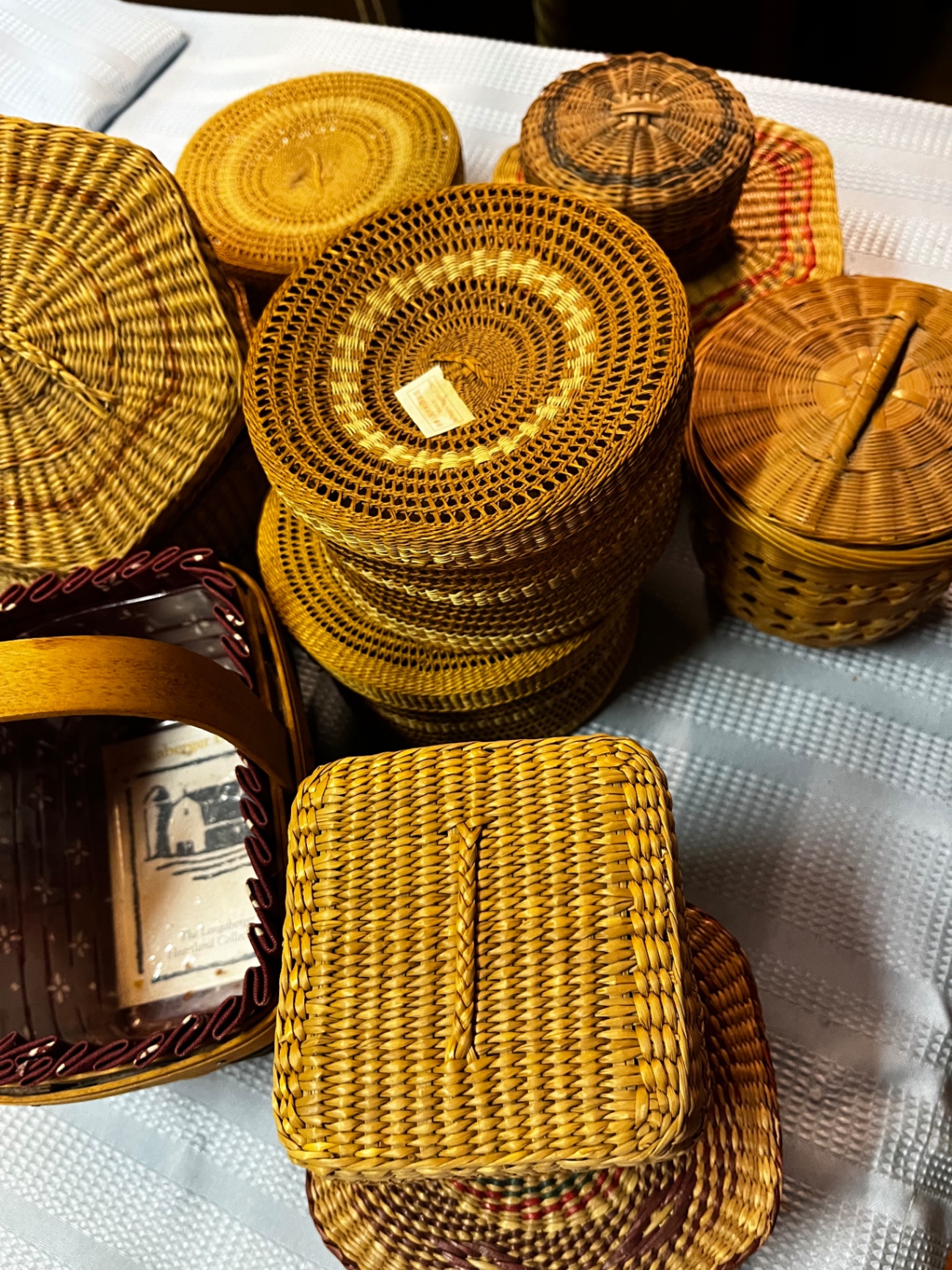 An assortment of small woven baskets and a small Longaberger handled basket - image 3 of 3