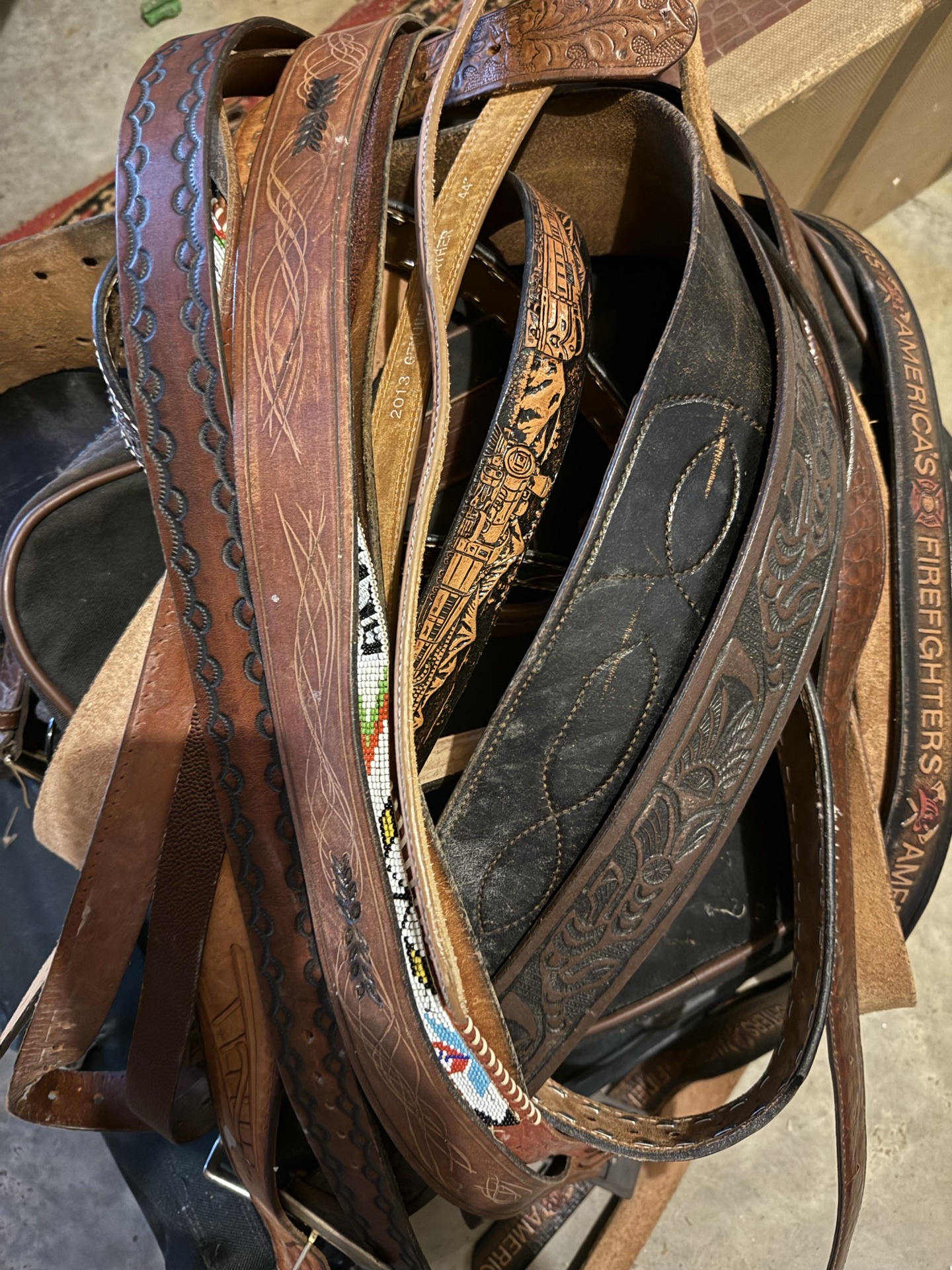 Assorted leather belts with Western tooling - image 1 of 5