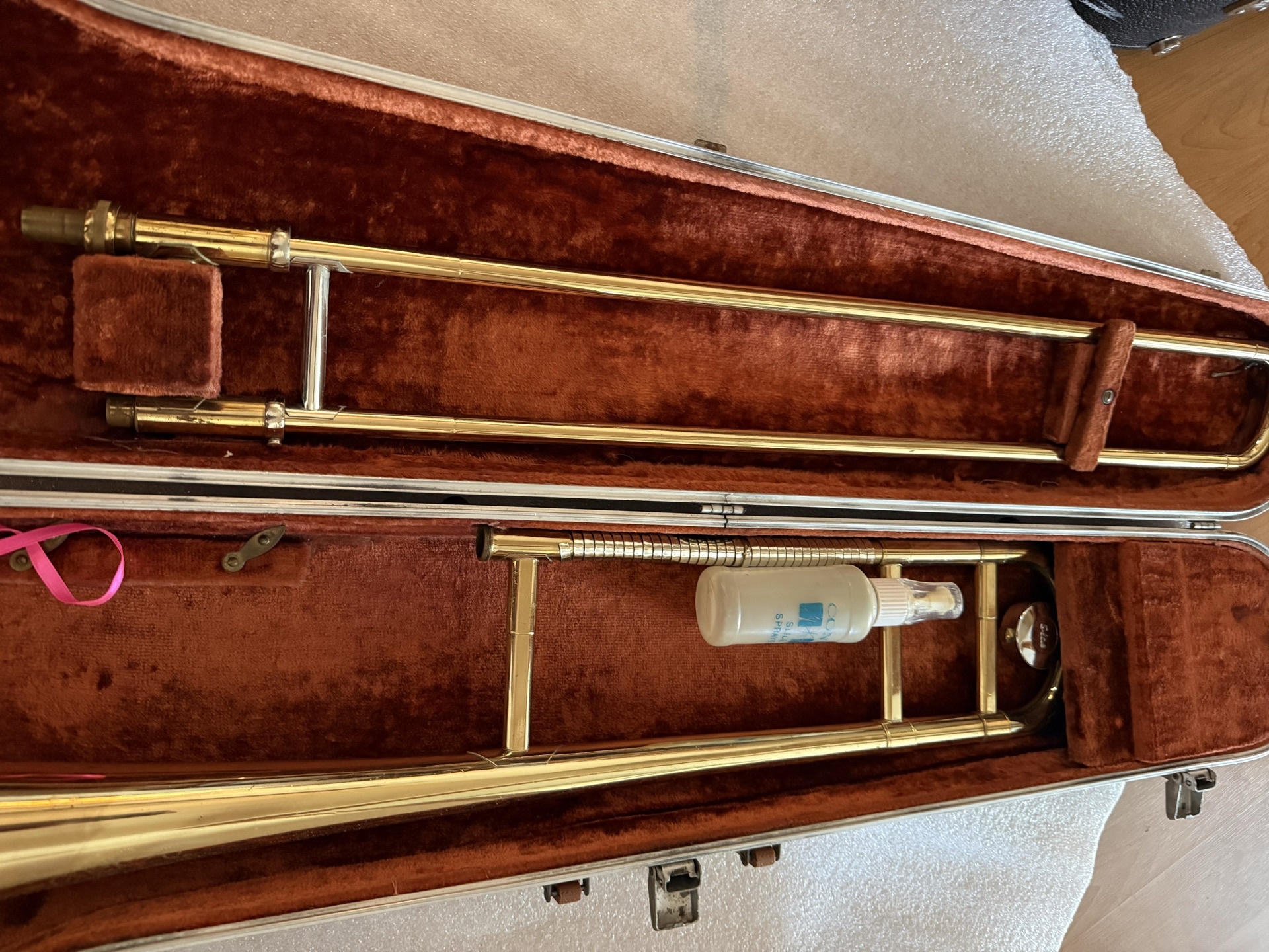 Brass trombone in a brown plush-lined case - image 3 of 7