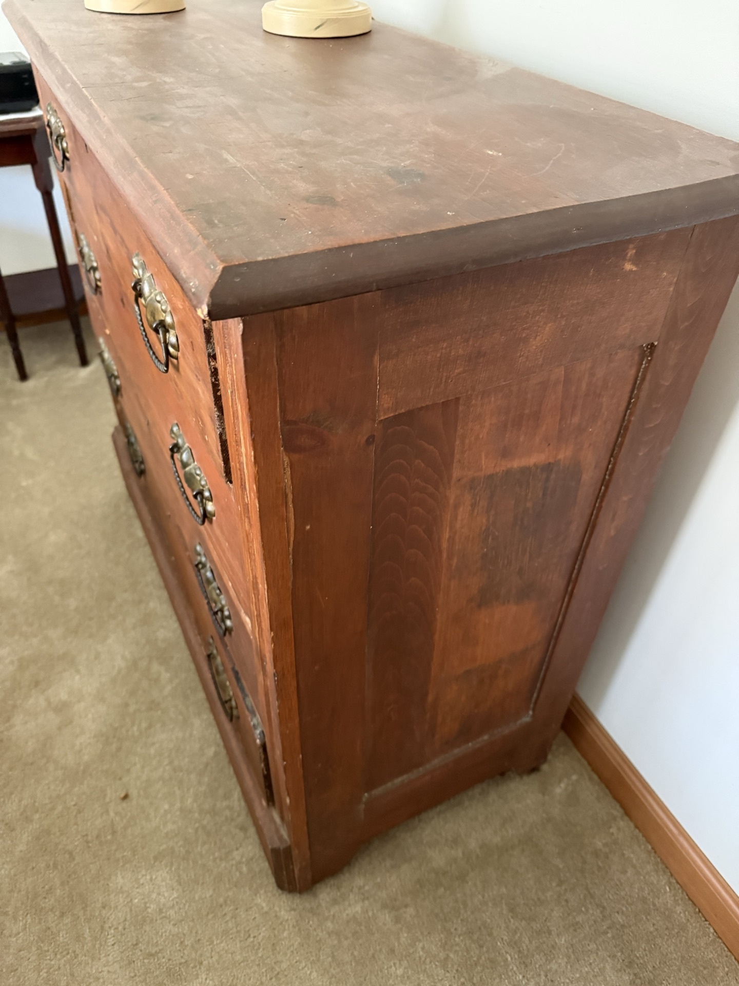 Antique wooden dresser with brass hardware and two beige table lamps - image 4 of 5
