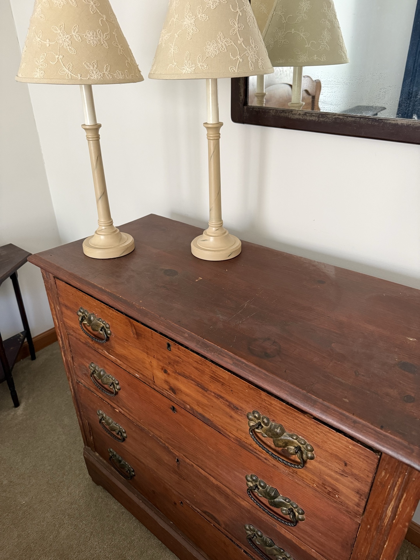 Antique wooden dresser with brass hardware and two beige table lamps - image 1 of 5