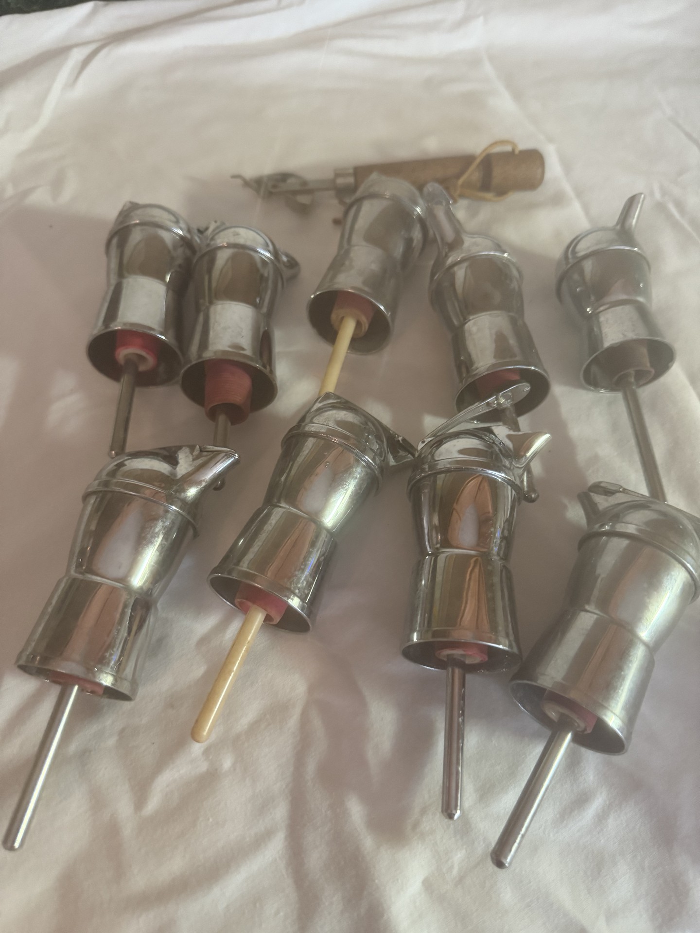 Set of small metal cylindrical components with rods - image 1 of 3