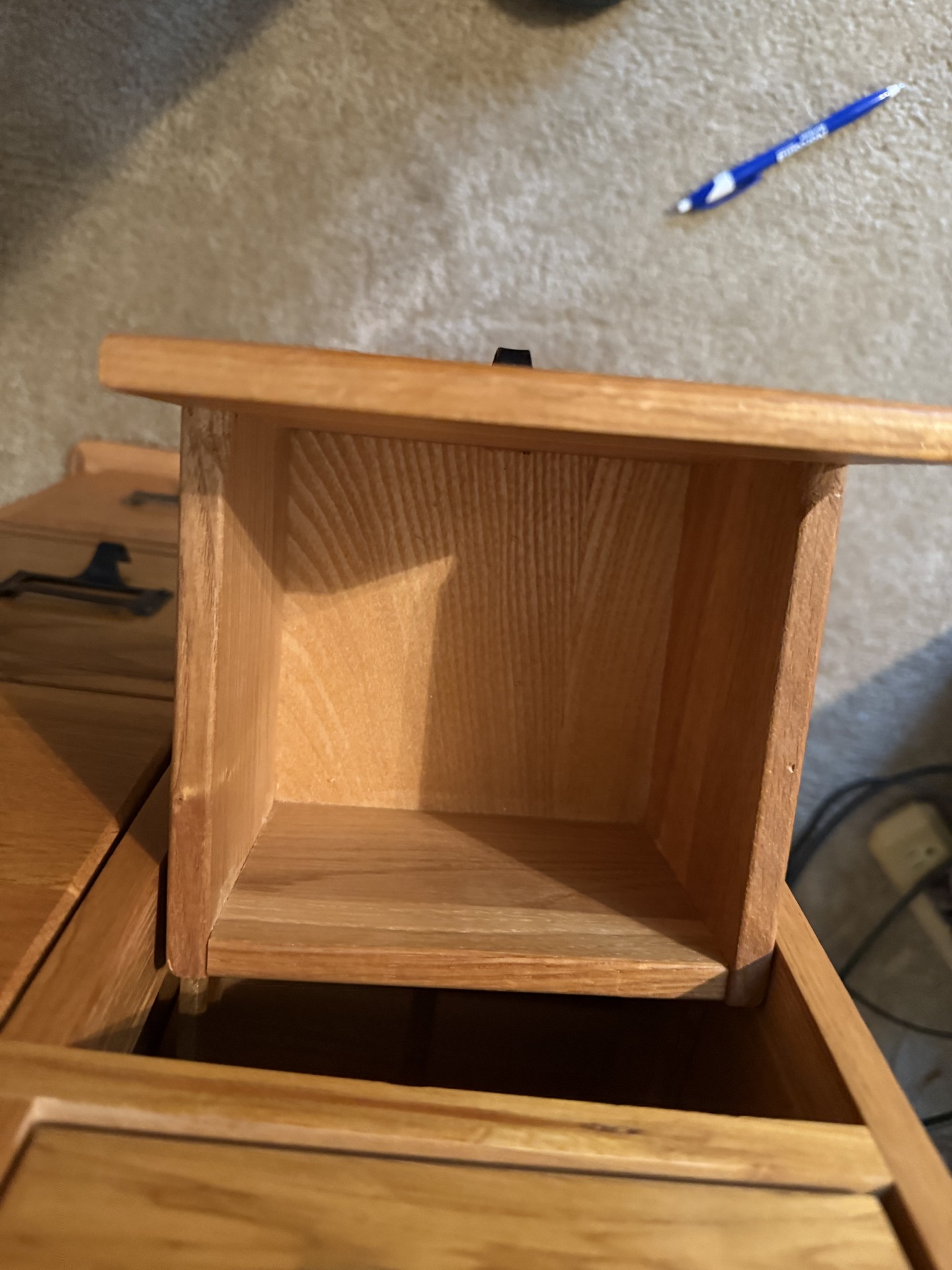 Oak-finished tall cabinet with multiple small drawers - image 10 of 12