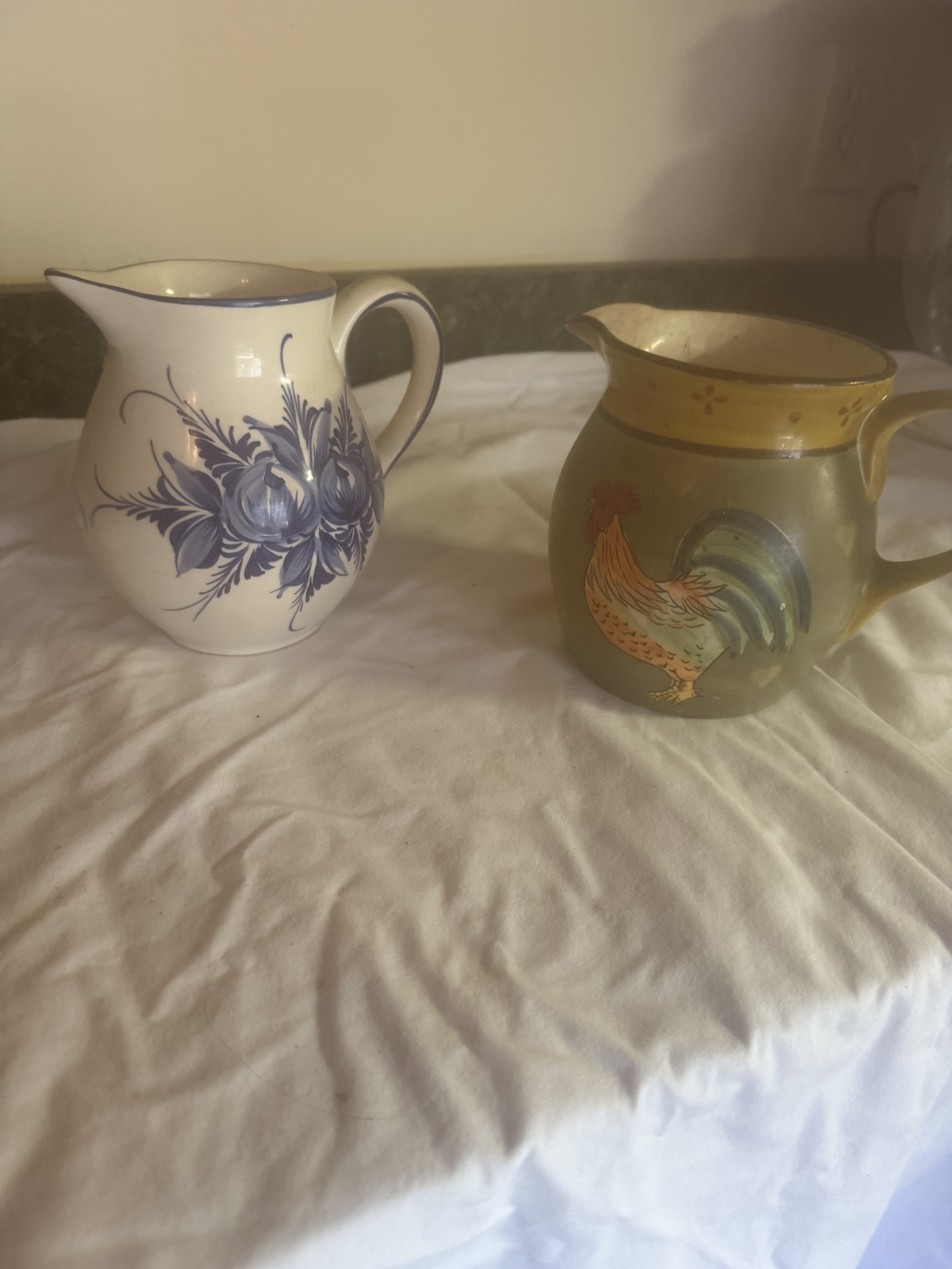 Two ceramic pitchers with floral and rooster designs - image 1 of 8