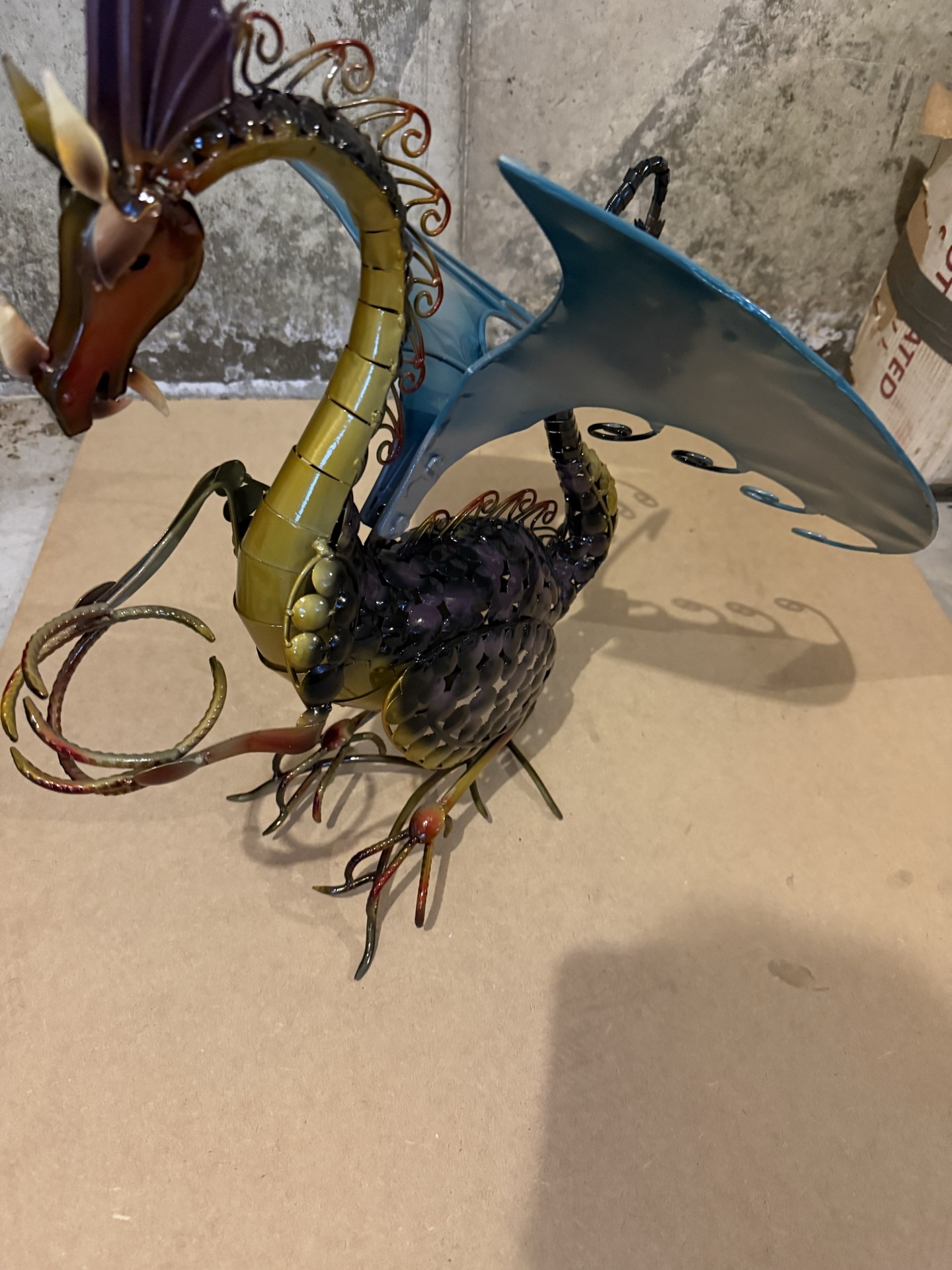 Metal dragon sculpture with blue wings - image 1 of 5