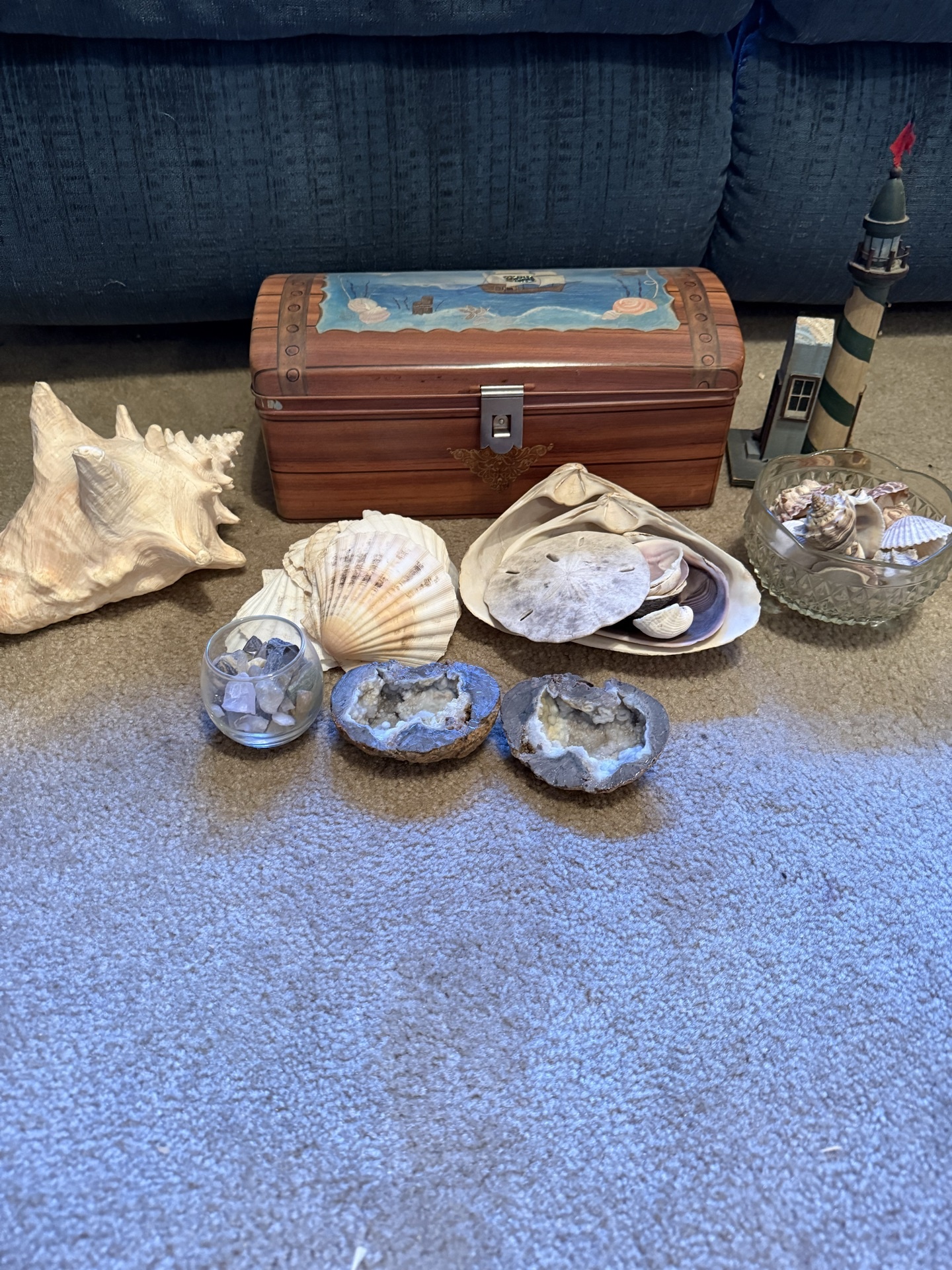 Coastal seashells, geodes, lighthouse models, and decorative chest - image 1 of 8