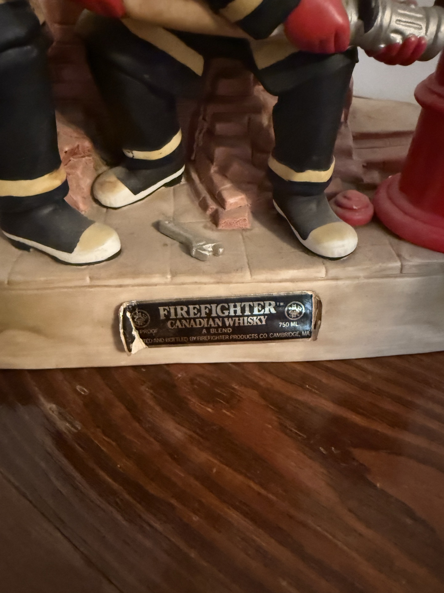 Firefighter figurine sculpture with hydrant and brick wall - image 2 of 4