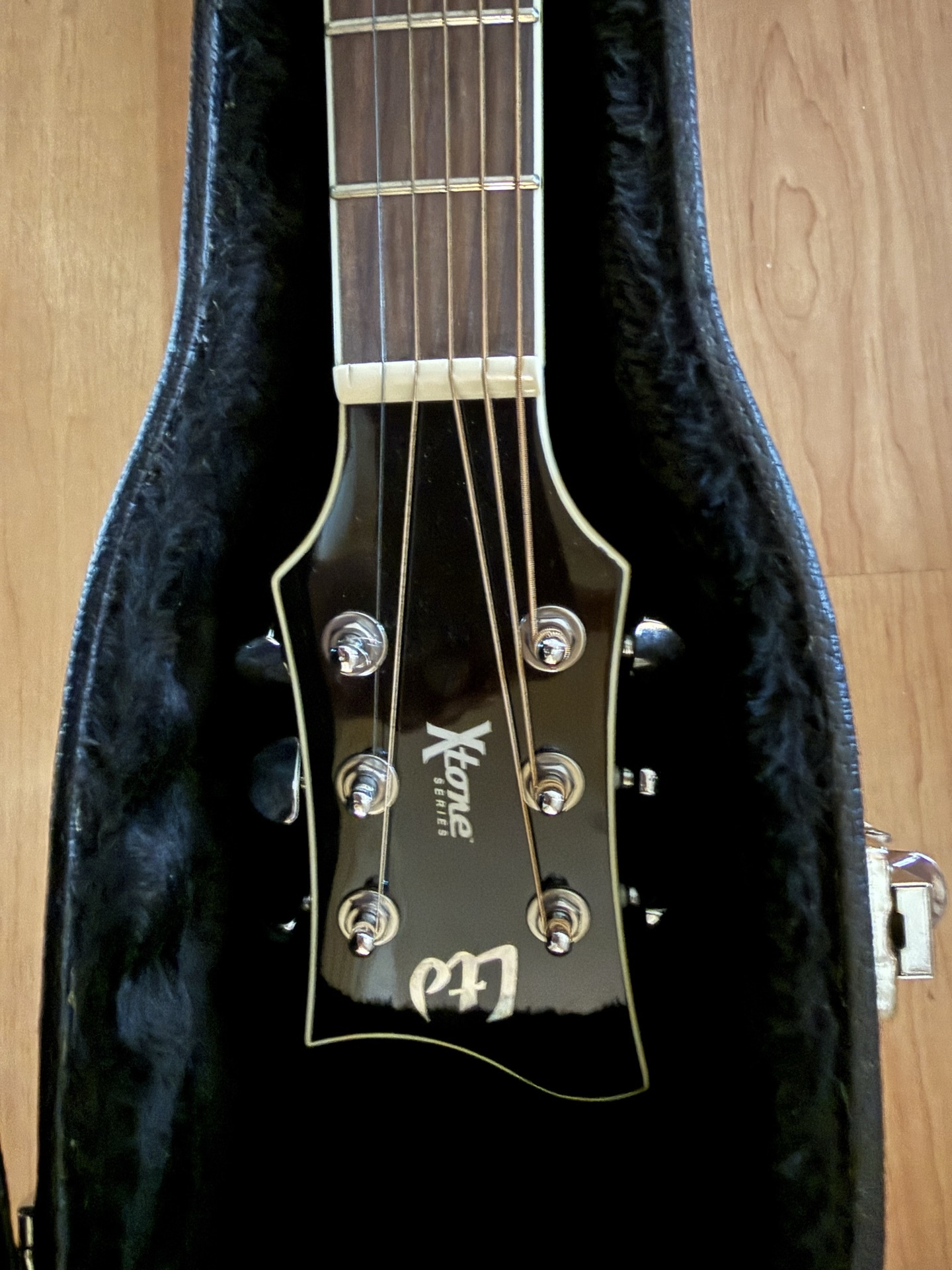 Black acoustic guitar in a hard case - image 2 of 8