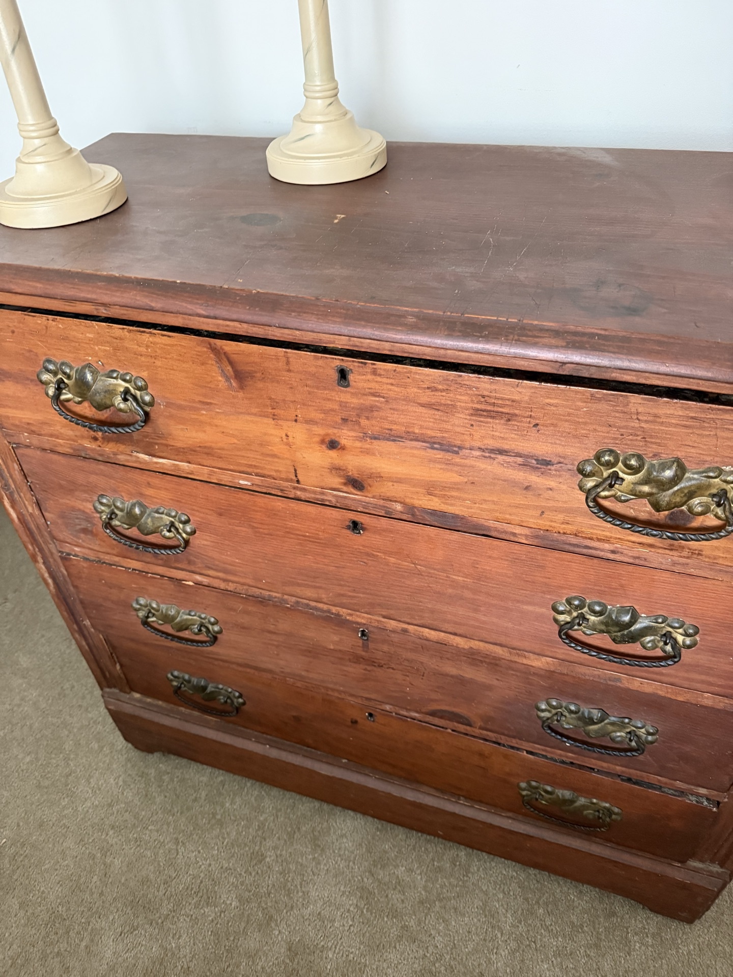 Antique wooden dresser with brass hardware and two beige table lamps - image 2 of 5