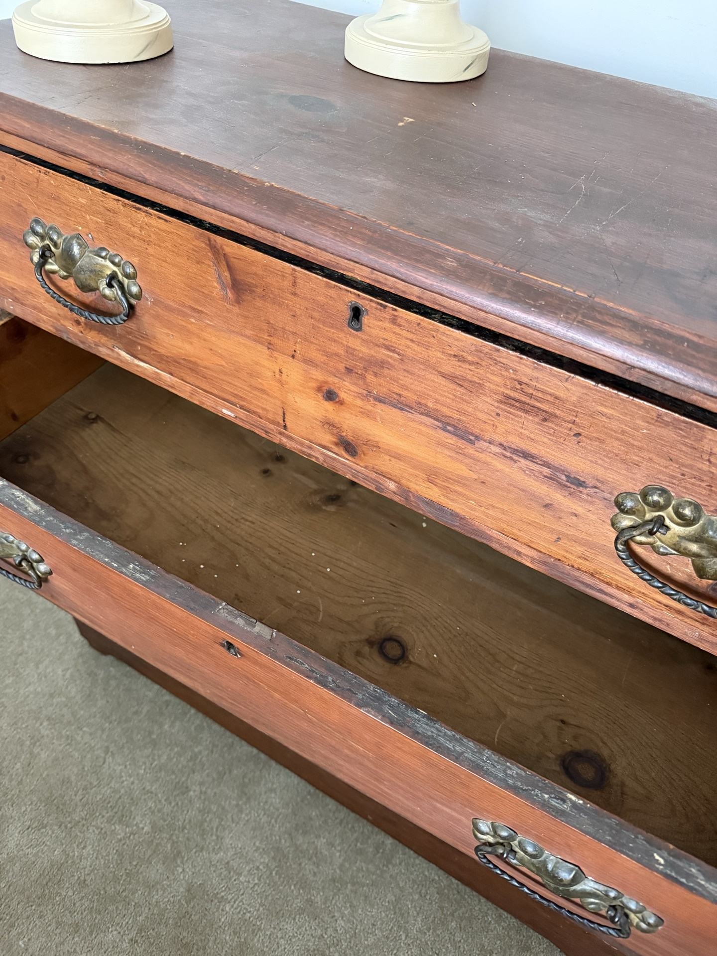 Antique wooden dresser with brass hardware and two beige table lamps - image 3 of 5