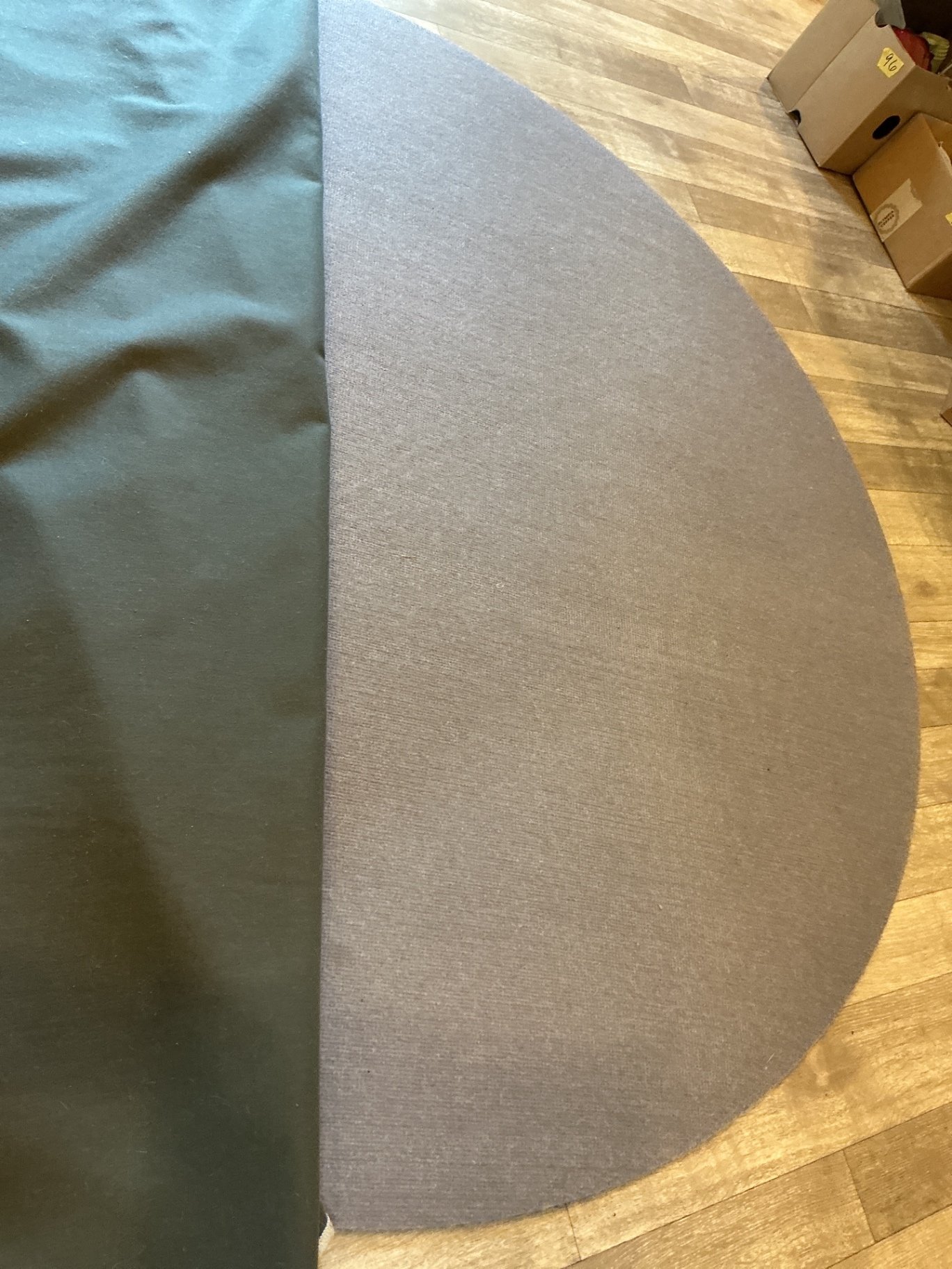 Round gray area rug with white grid pattern - image 2 of 3