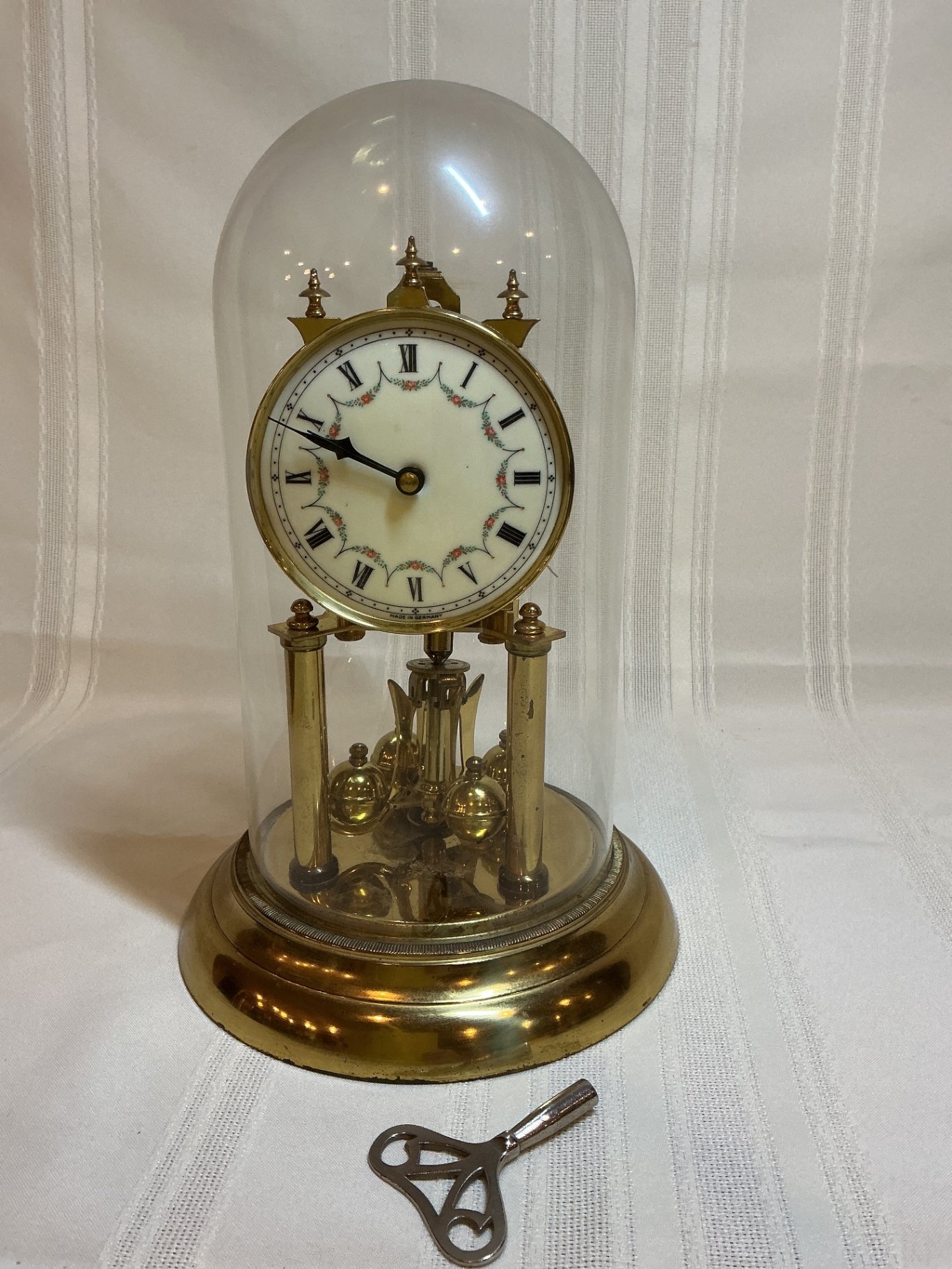 Brass anniversary clock under glass dome  - image 1 of 5