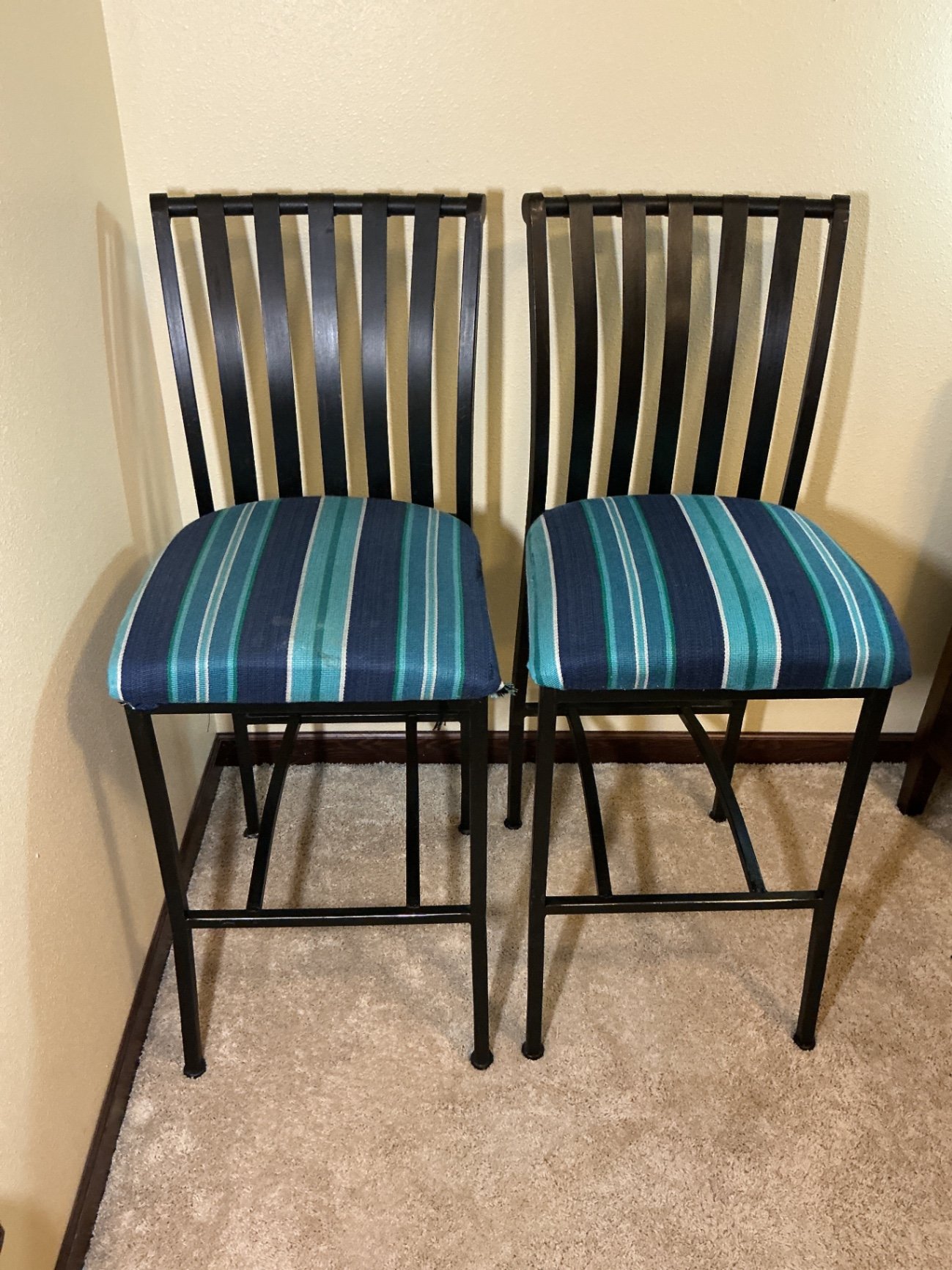Pair of black metal bar stools with striped upholstery - image 1 of 5