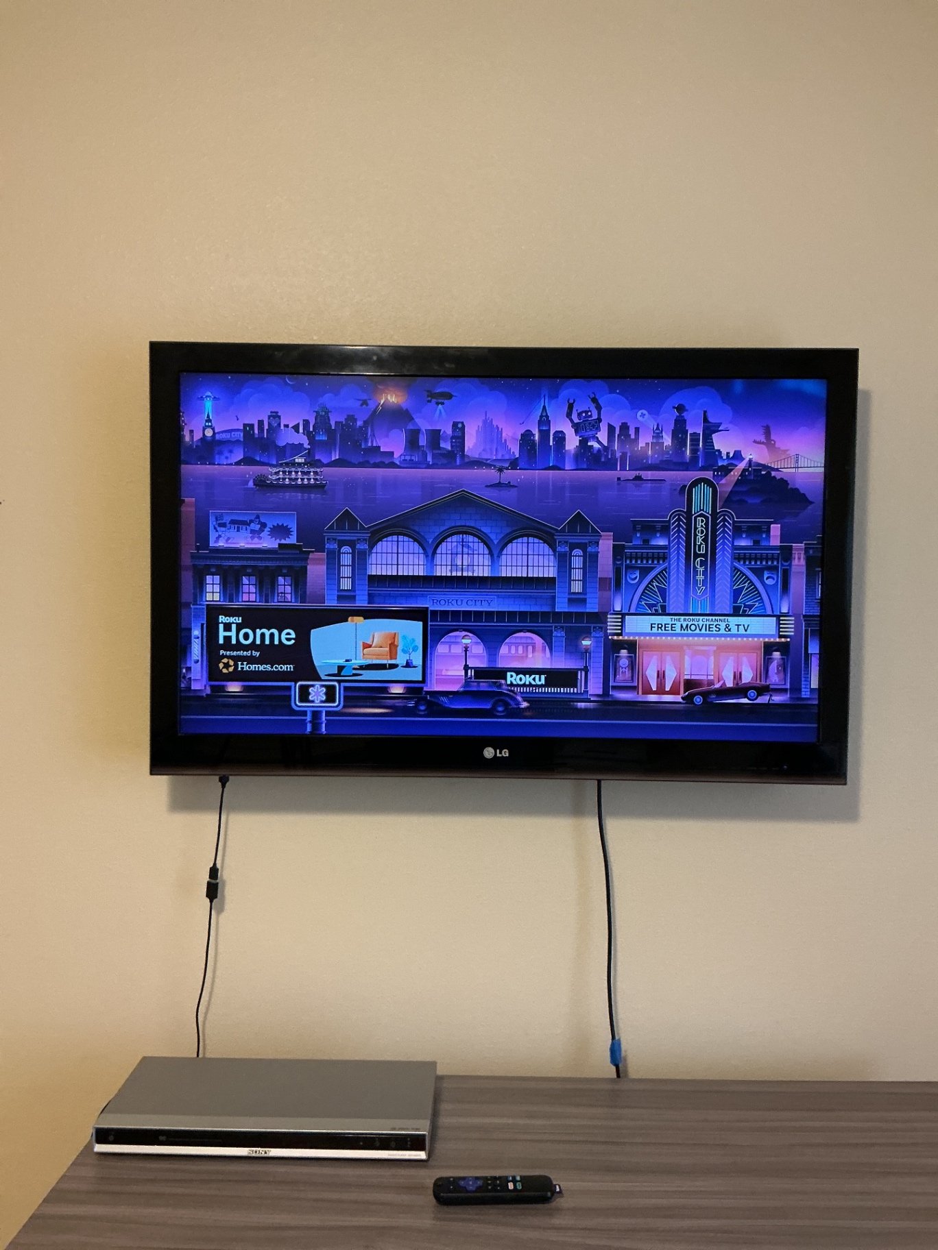 Wall-mounted LG TV with Sony DVD Player - image 1 of 5