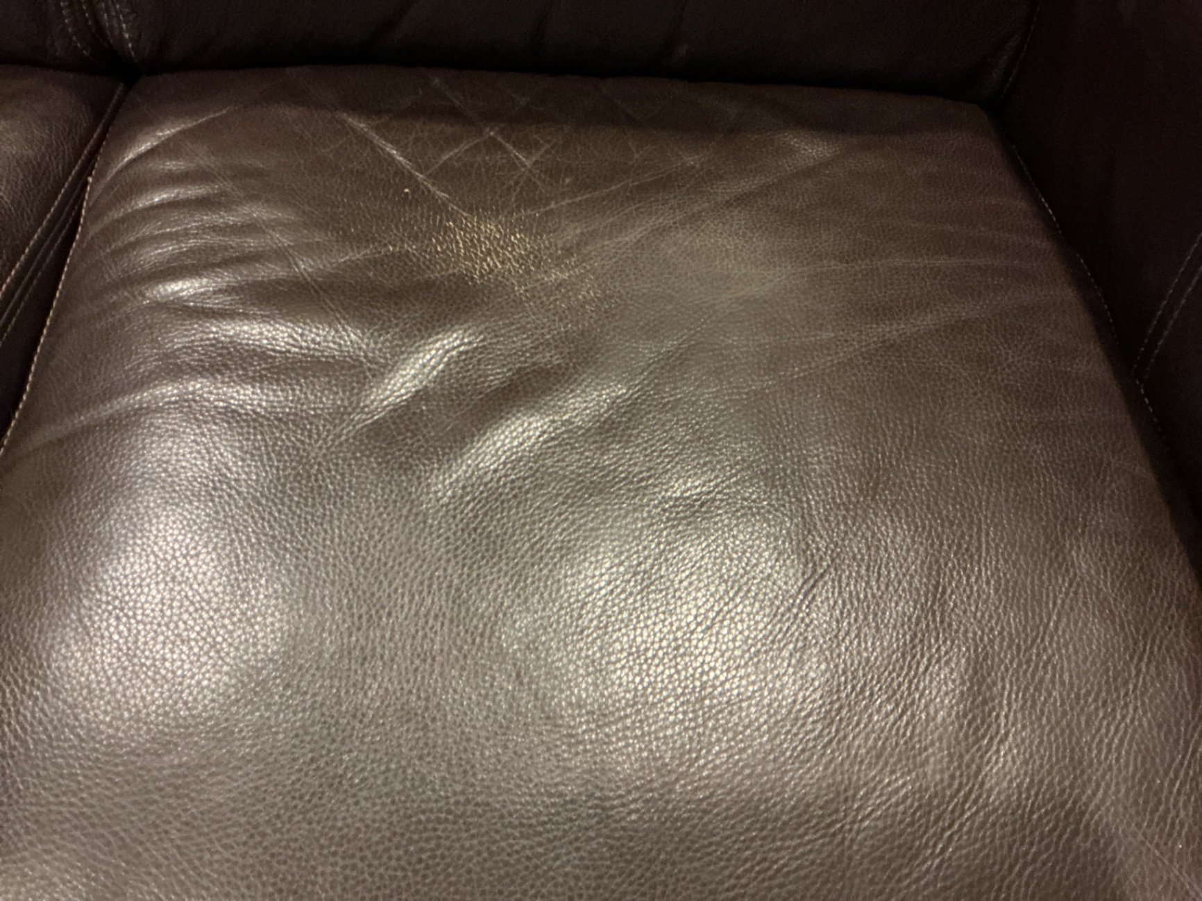 Dark brown leather loveseat with decorative pillows - image 9 of 10