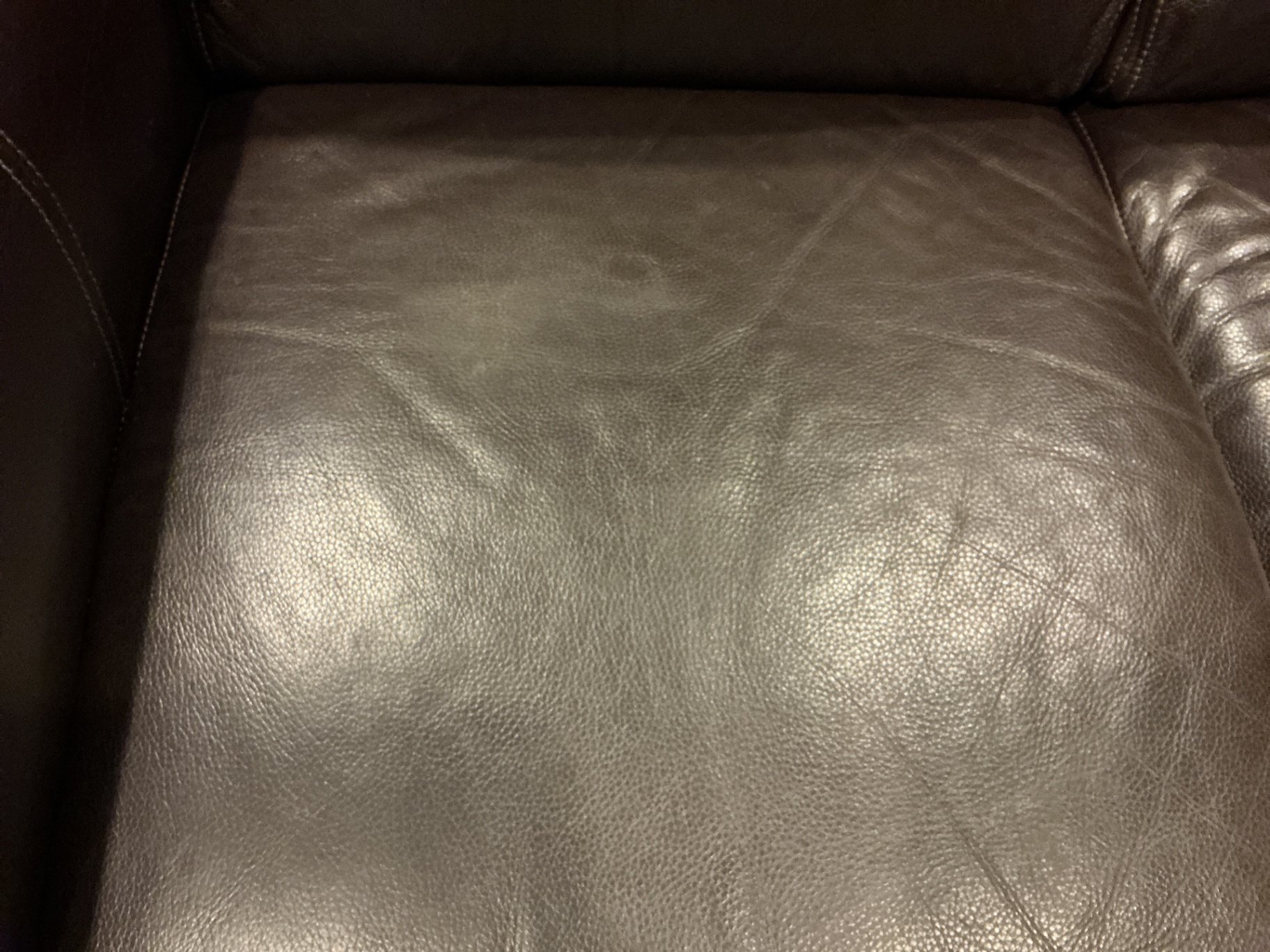 Dark brown leather loveseat with decorative pillows - image 10 of 10