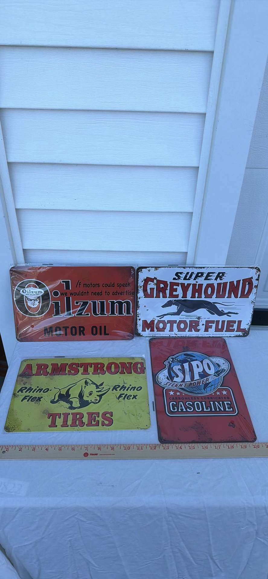 Four Vintage-Style Automotive Advertising Metal Signs - Oilzum, Greyhound, Armstrong, Sipo - image 1 of 3