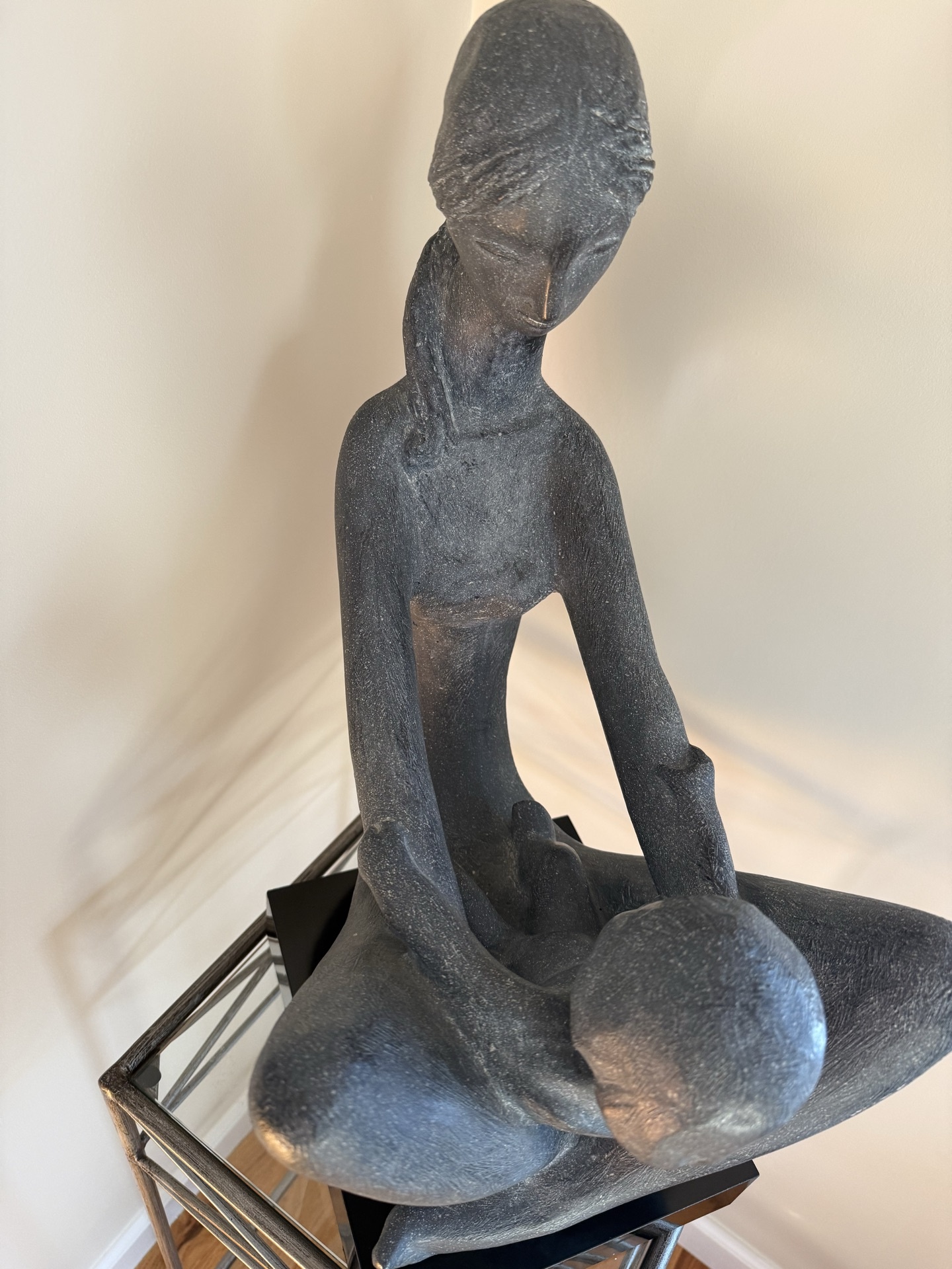 Abstract seated sculpture on metal stand - image 2 of 5