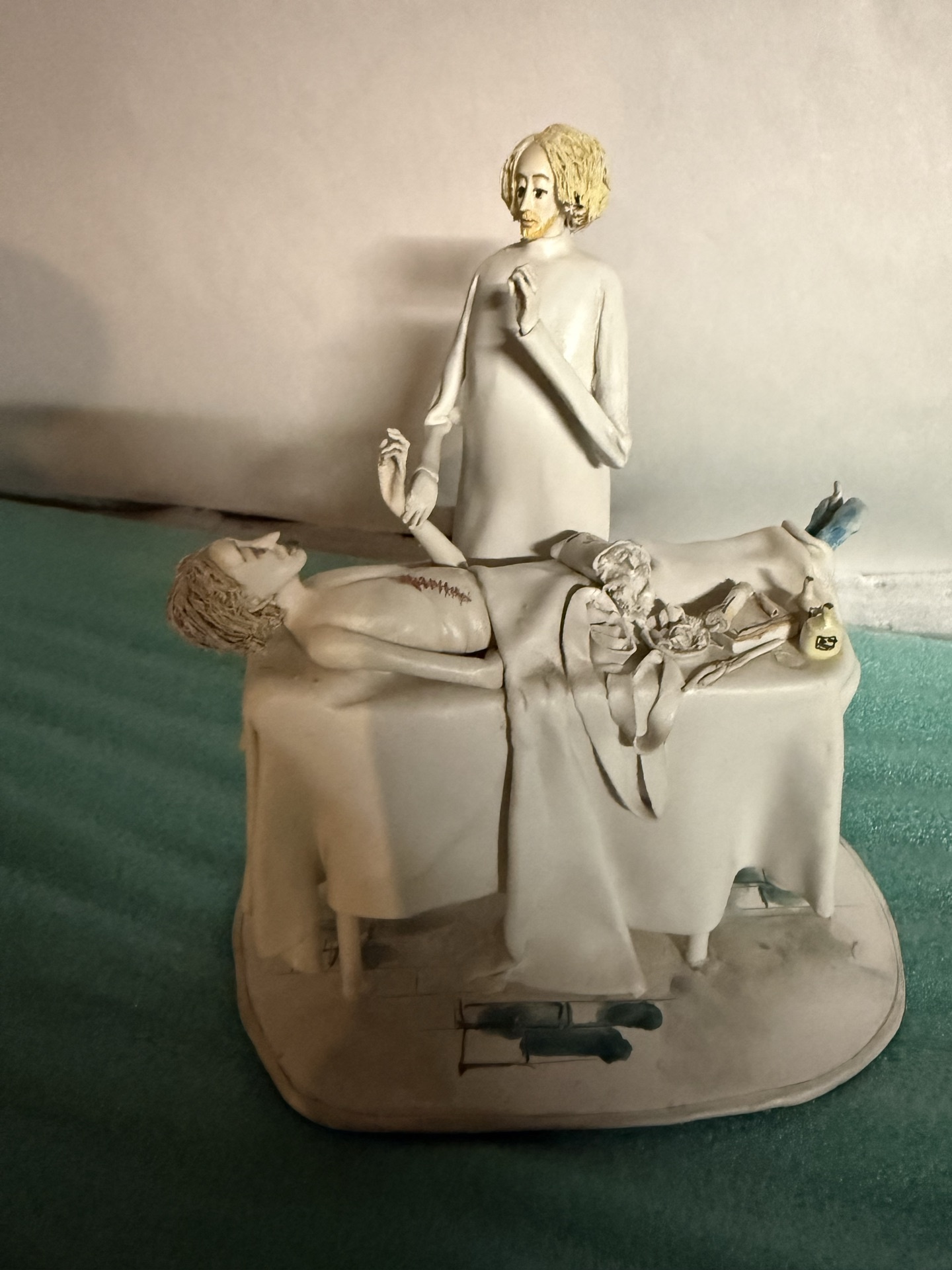 White ceramic medical-scene sculpture with  - image 1 of 5
