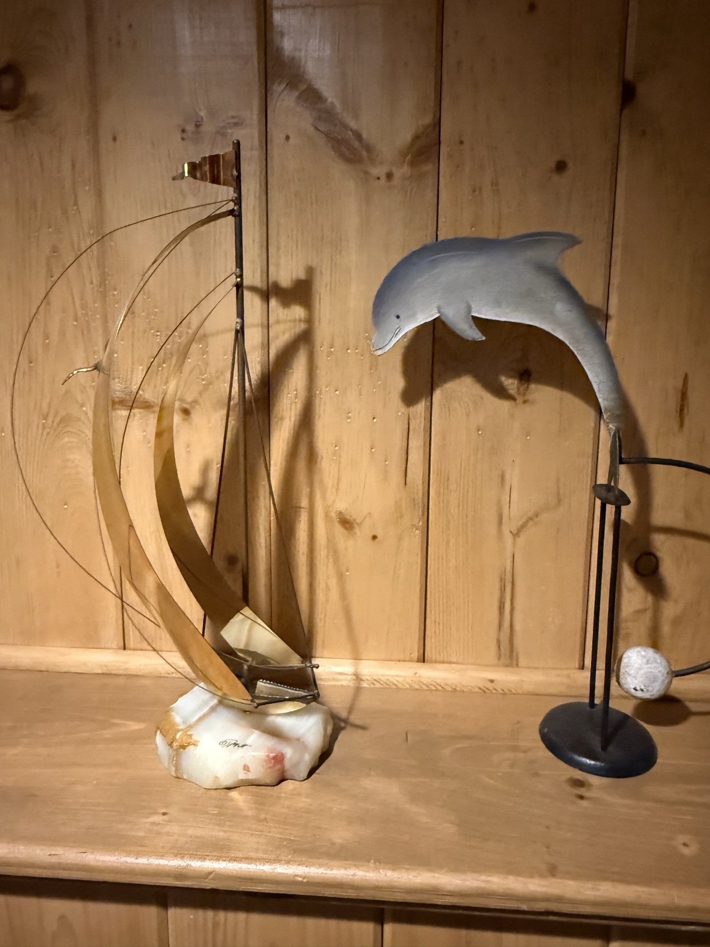 Abstract metal ring sculpture and dolphin figurine sculptures - image 1 of 5