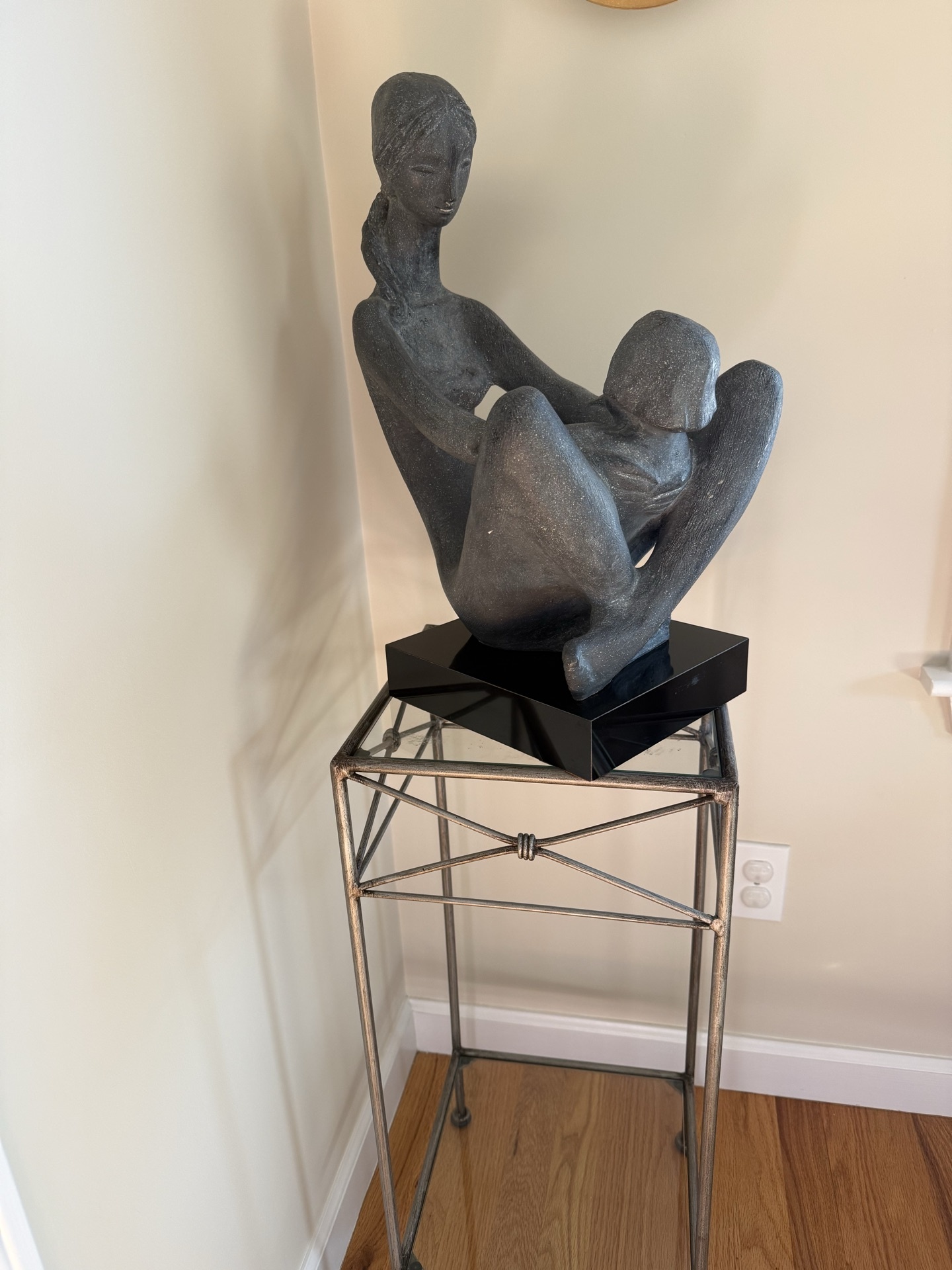Abstract seated sculpture on metal stand - image 1 of 5