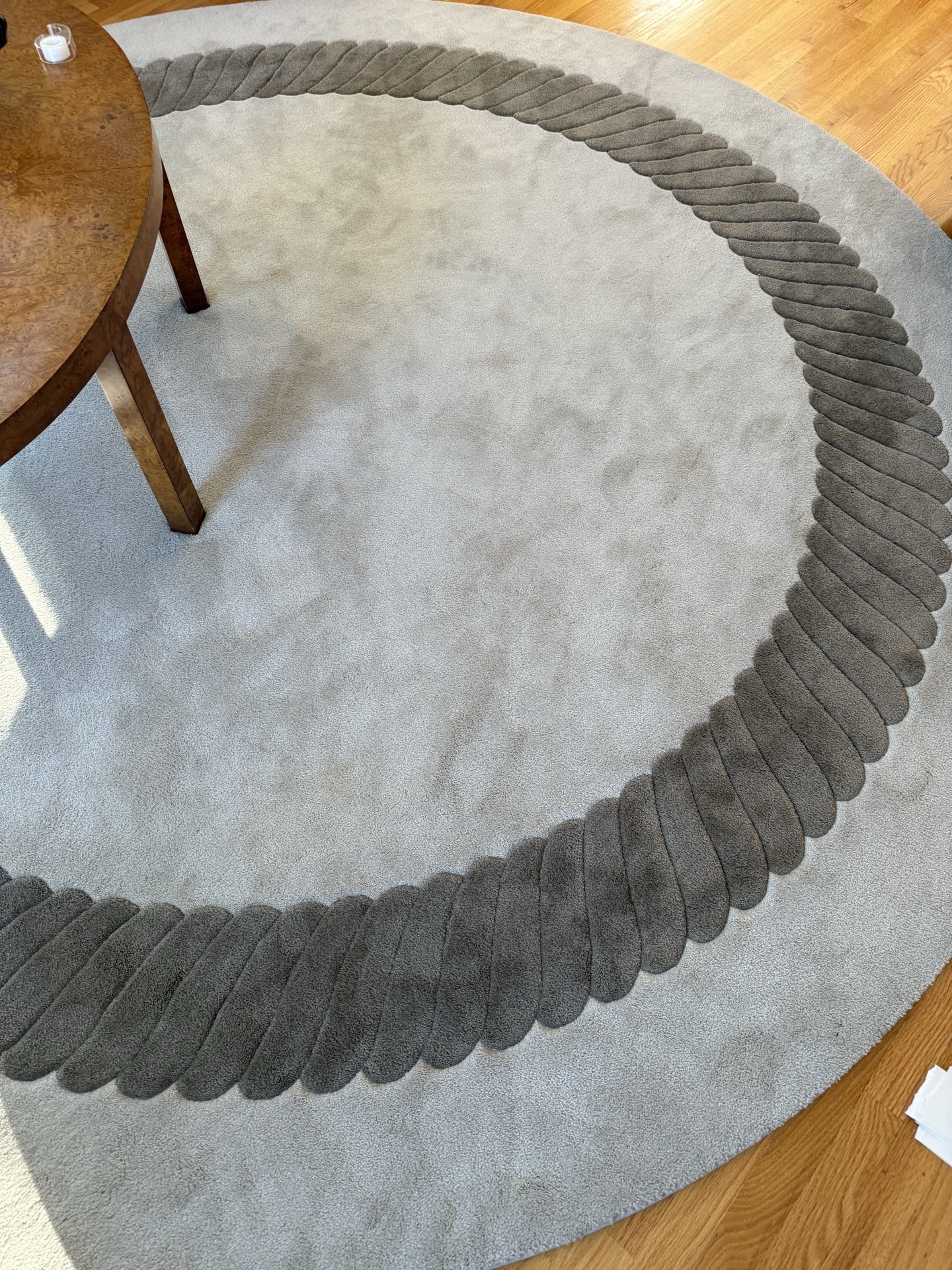 Round taupe rug with decorative border - image 3 of 4