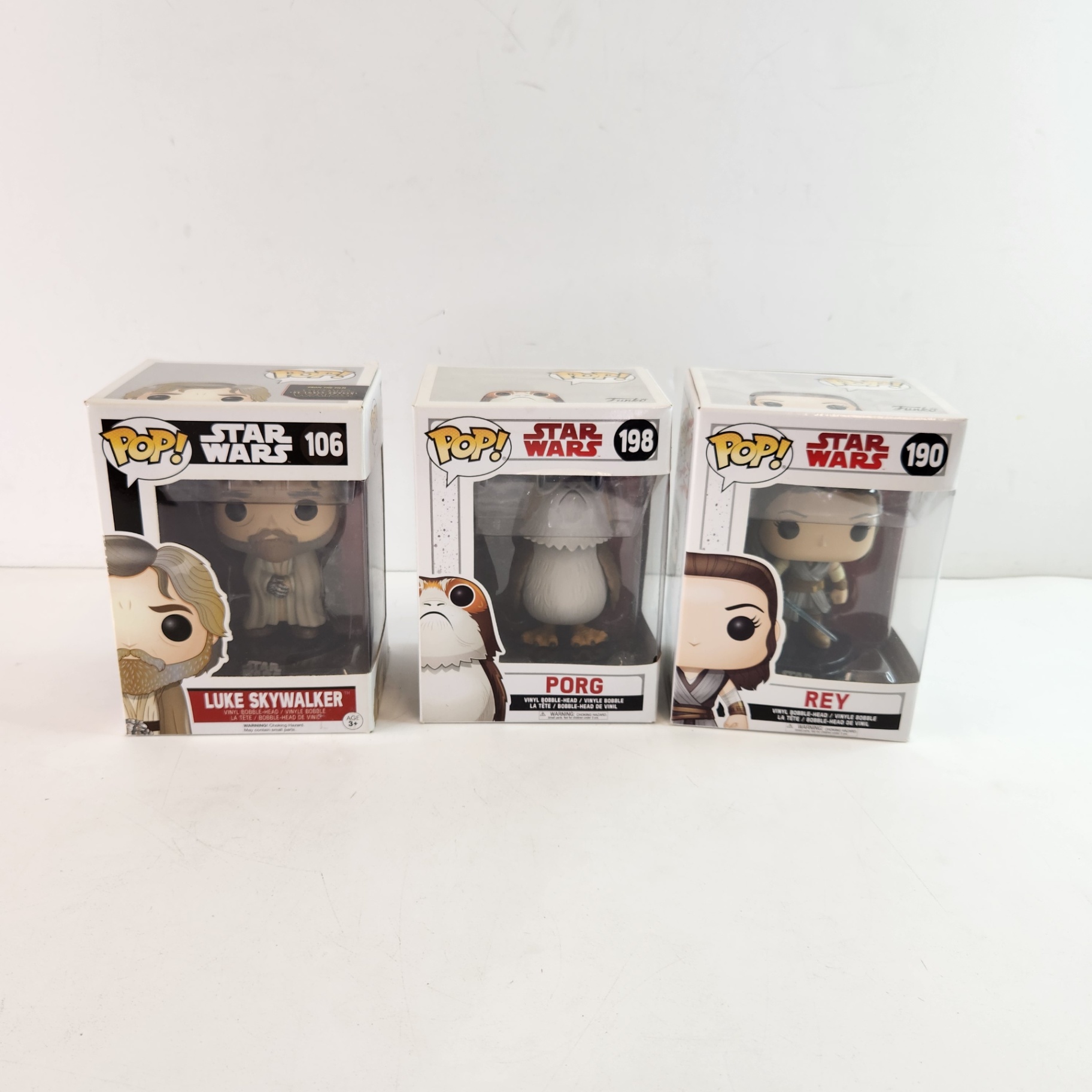 Star Wars Luke Skywalker Porg Rey Funko Pops - image 1 of 5