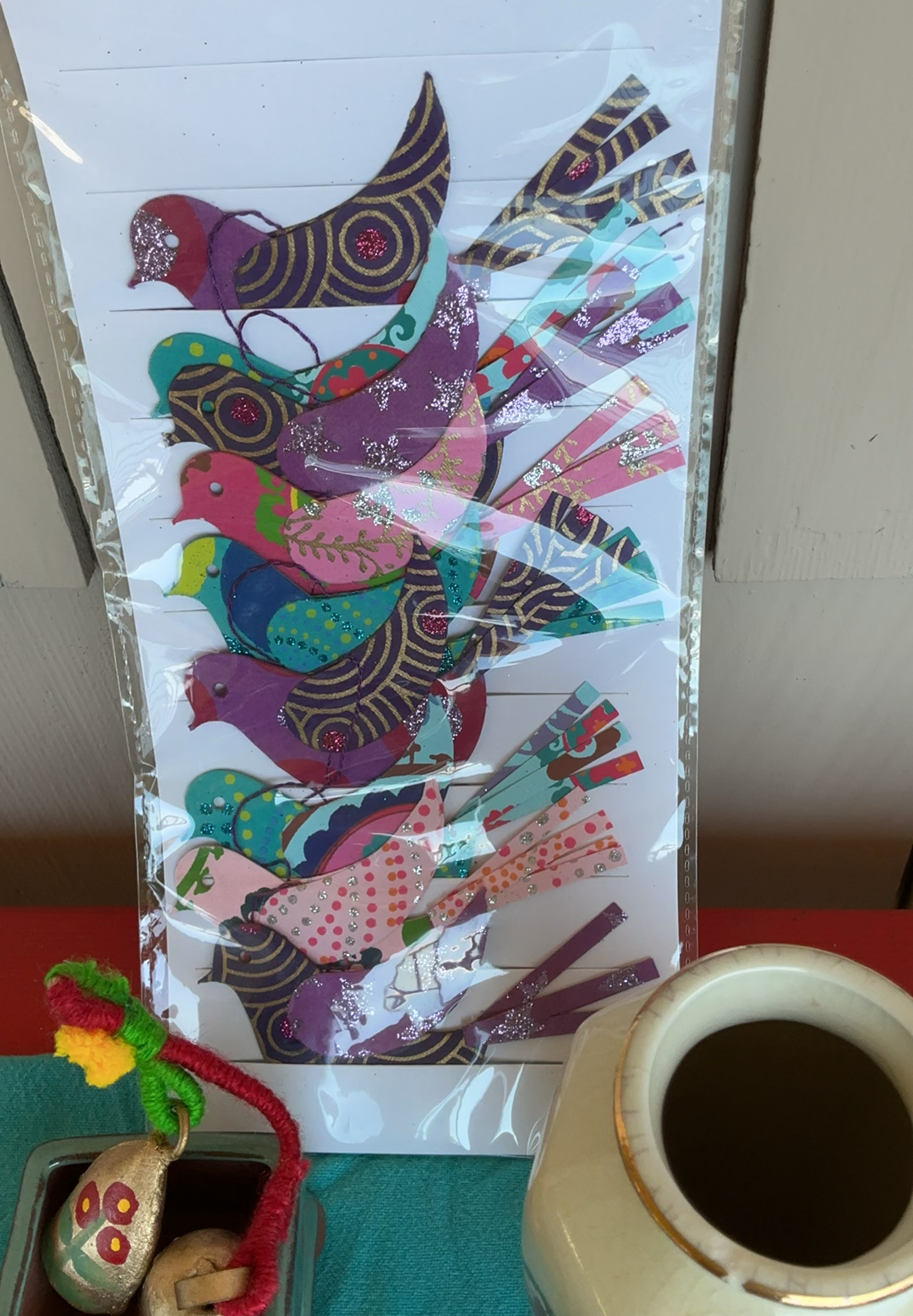 Assorted decorative Altar items: ceramics, artwork, crystals, and Tibetan prayer flags - image 2 of 9
