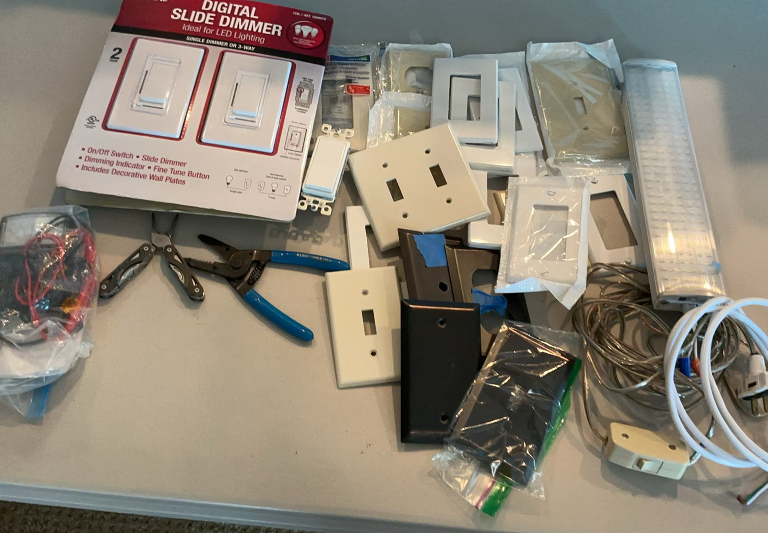 Assorted lighting switches, dimmers, wall plates, and wiring hardware - image 1 of 5