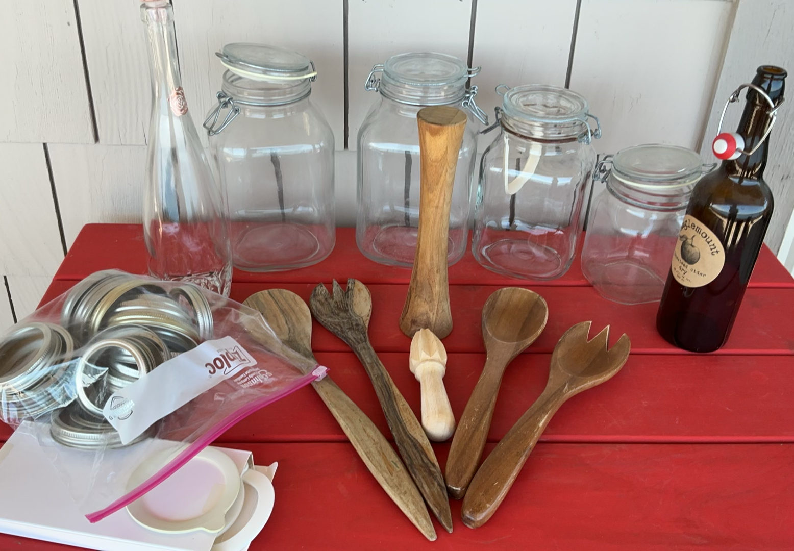 Assorted glass jars, bottles, and wooden kitchen utensils - image 1 of 6