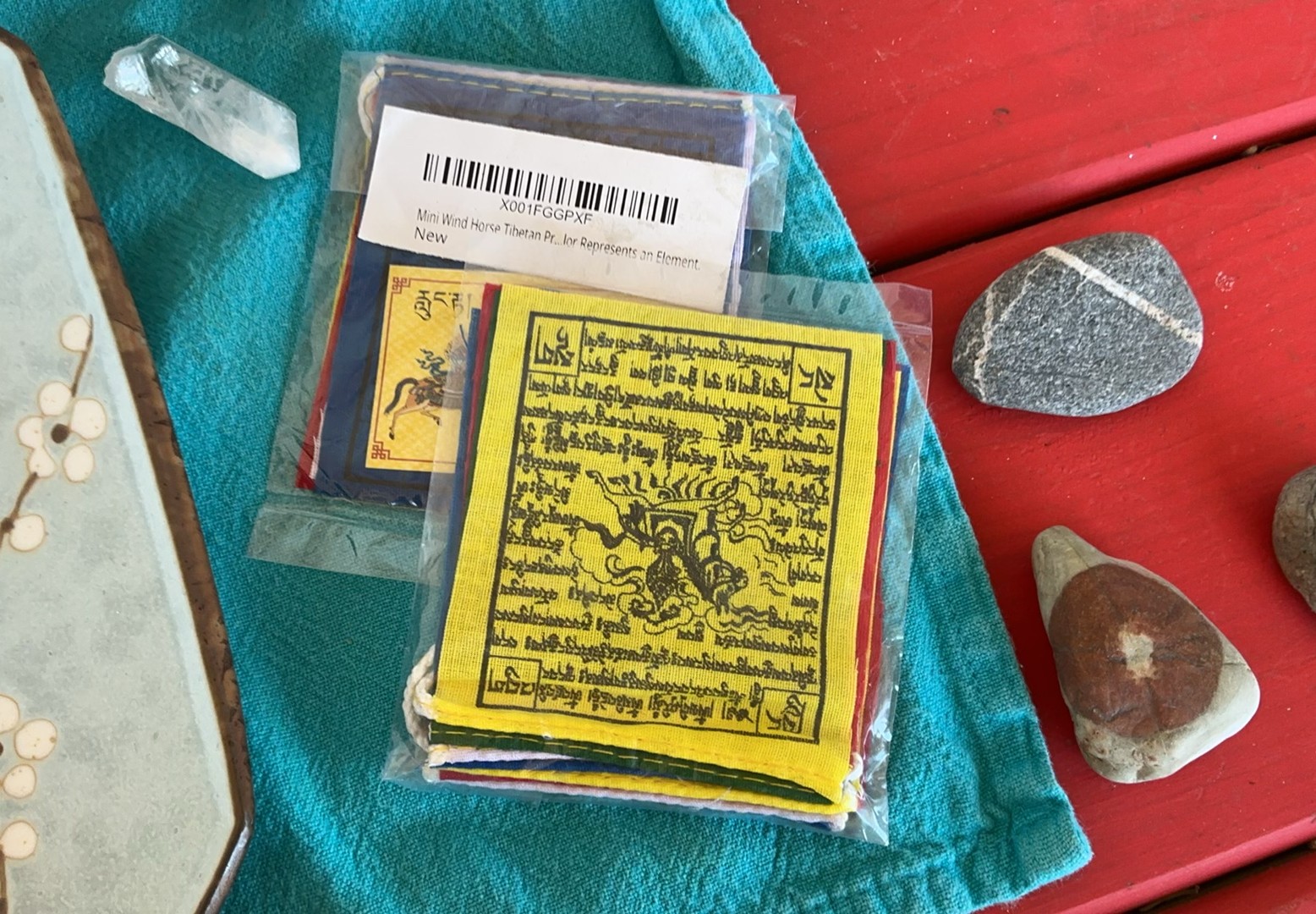 Assorted decorative Altar items: ceramics, artwork, crystals, and Tibetan prayer flags - image 6 of 9