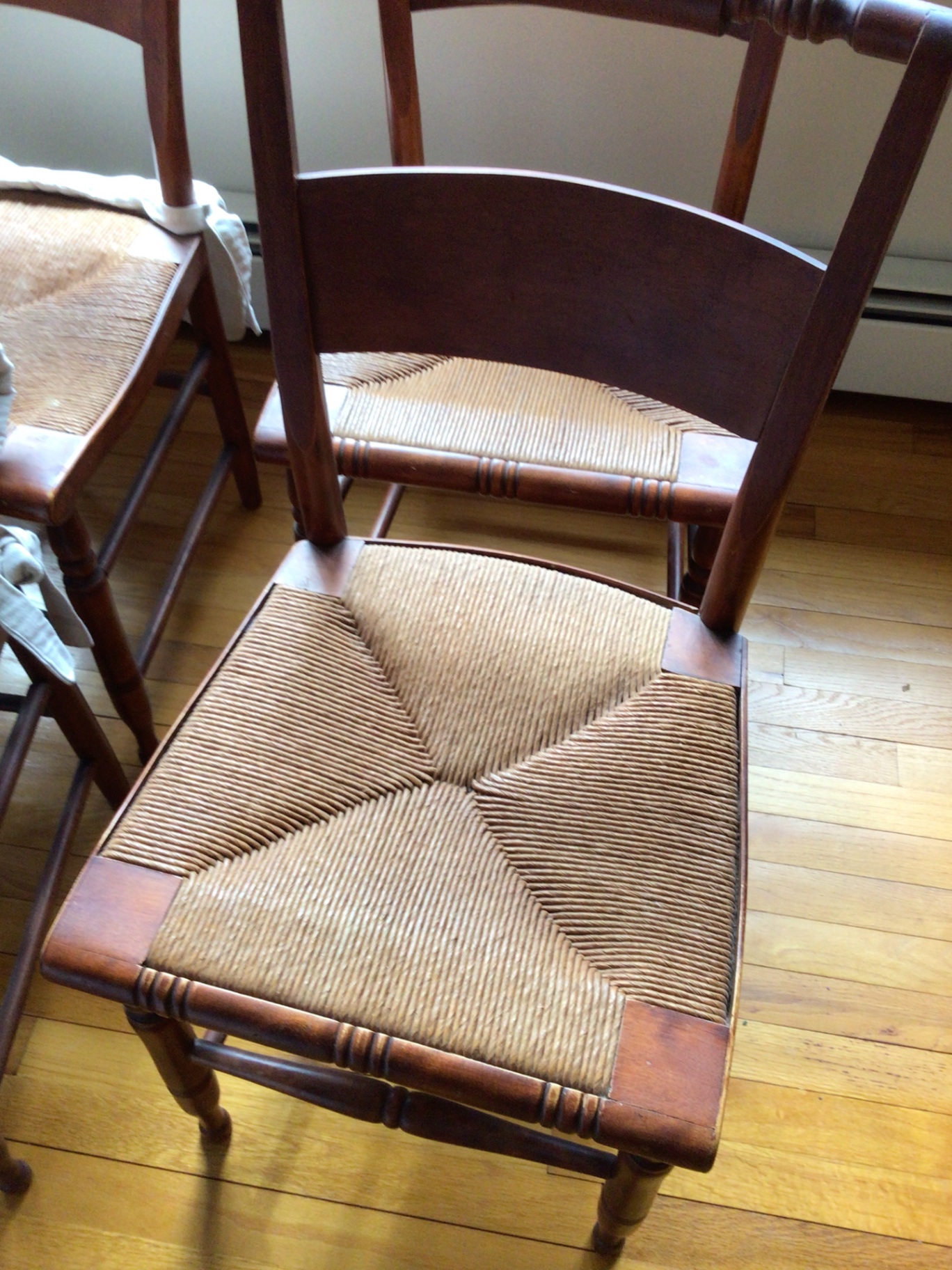 Wooden dining chairs with woven cane seats - image 3 of 6
