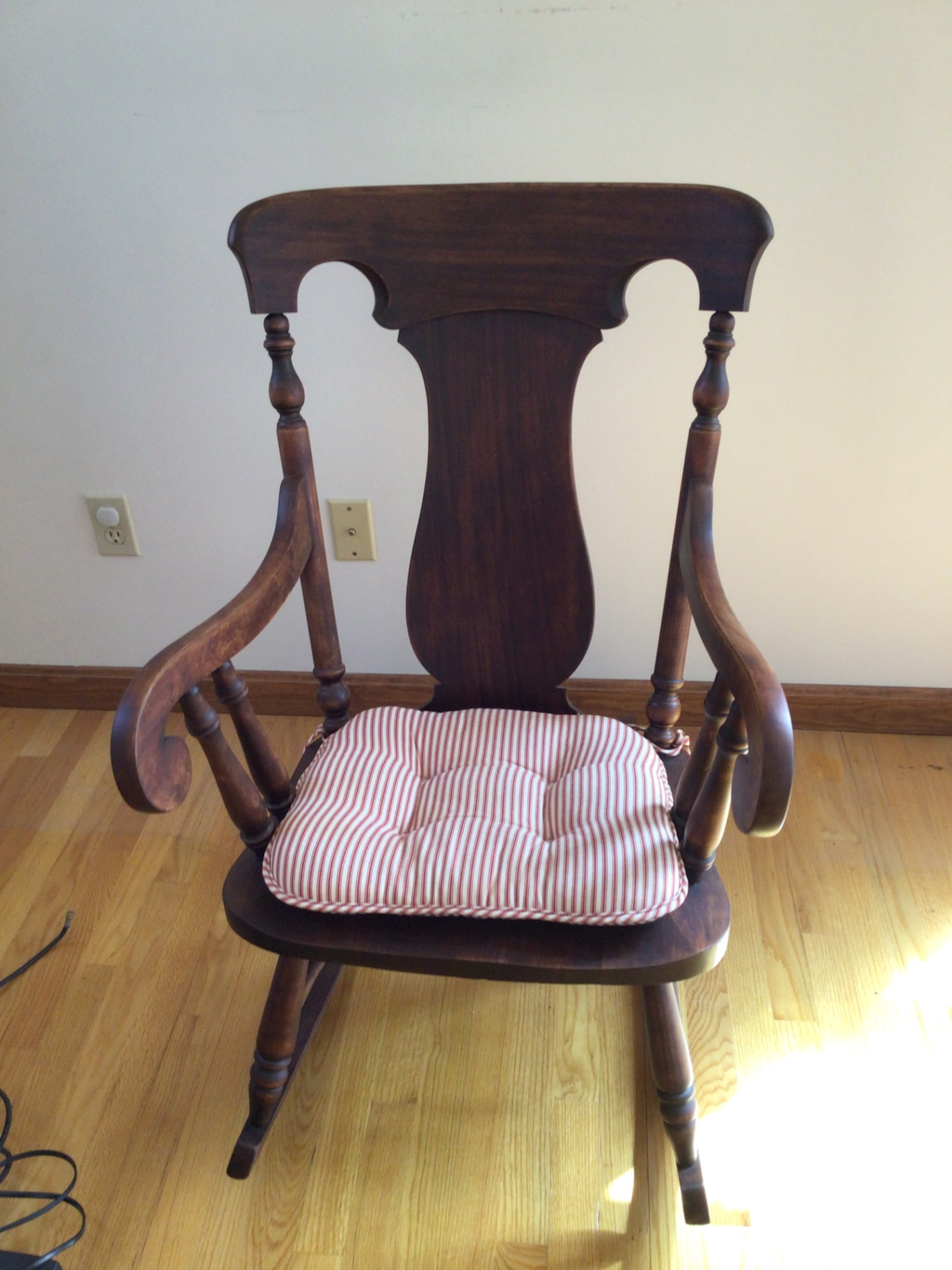 Wooden rocking chair with striped cushion - image 1 of 2