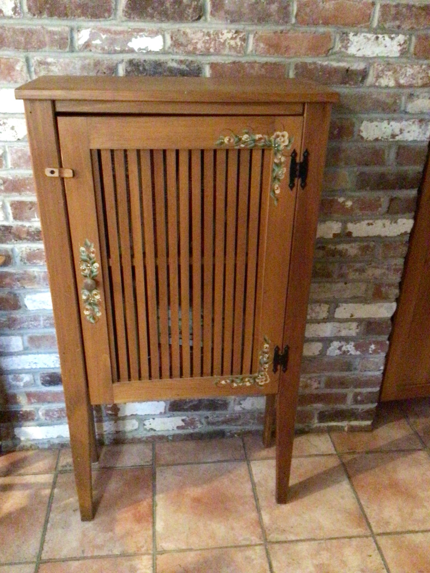 Wooden cabinet with slatted vent-style door - image 1 of 3