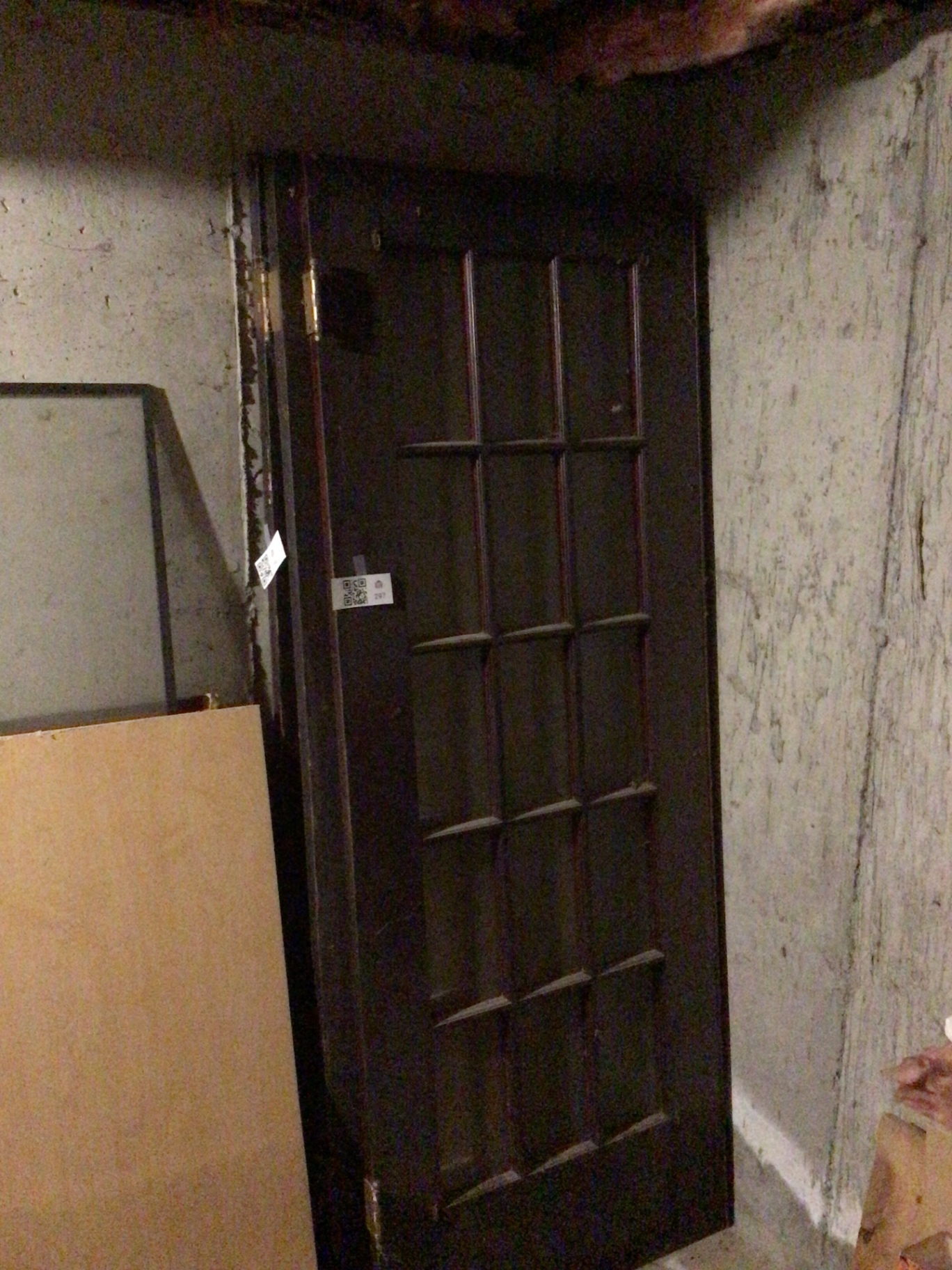 Black grid-pane door with window frame and plywood panel - image 3 of 3