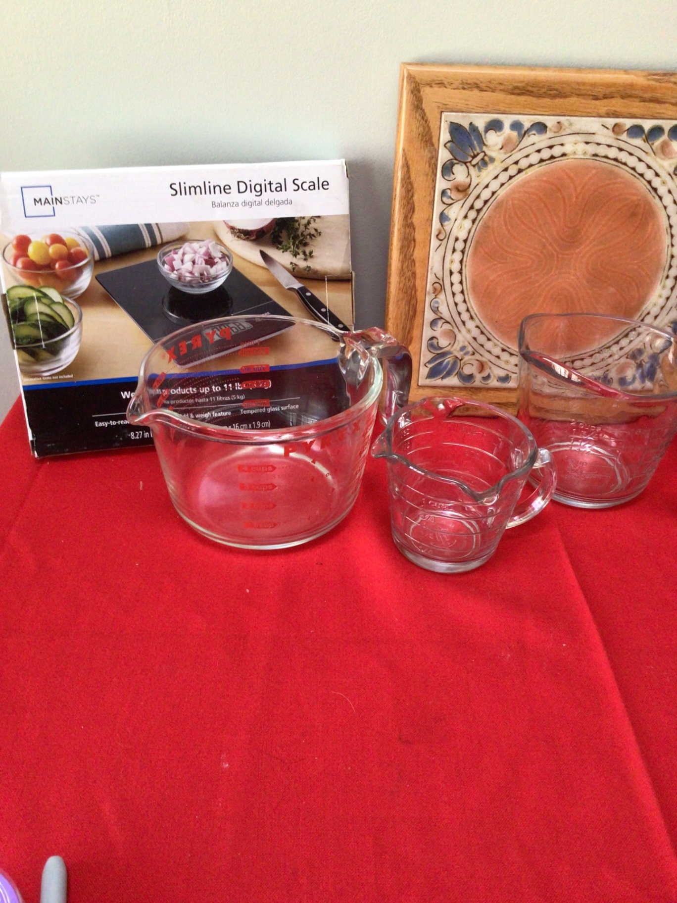 Glass measuring cups, digital scale box, and decorative tile art - image 2 of 3