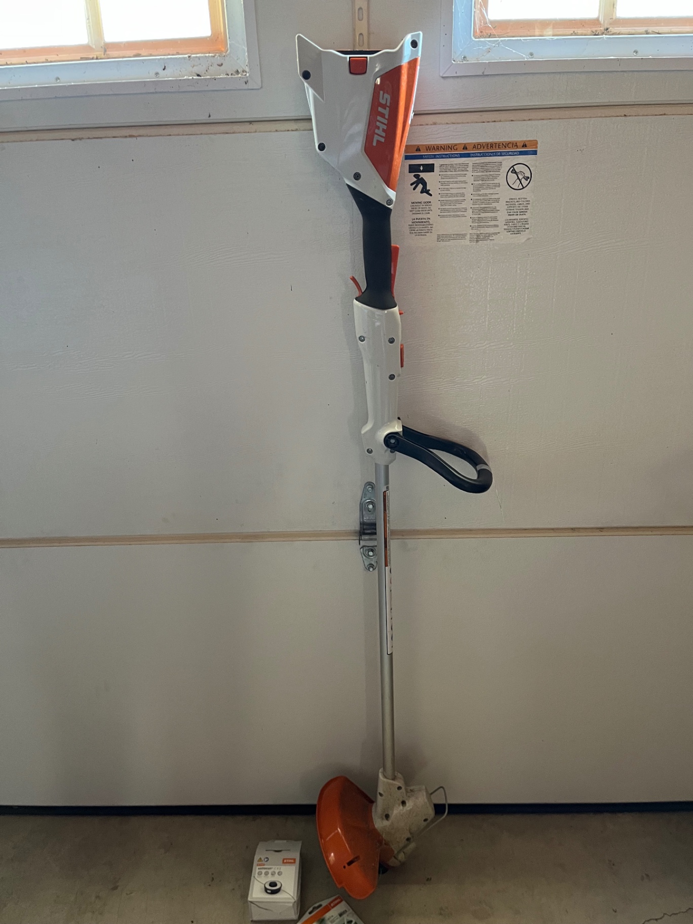 Stihl AK20 cordless string trimmer with accessories - image 1 of 3